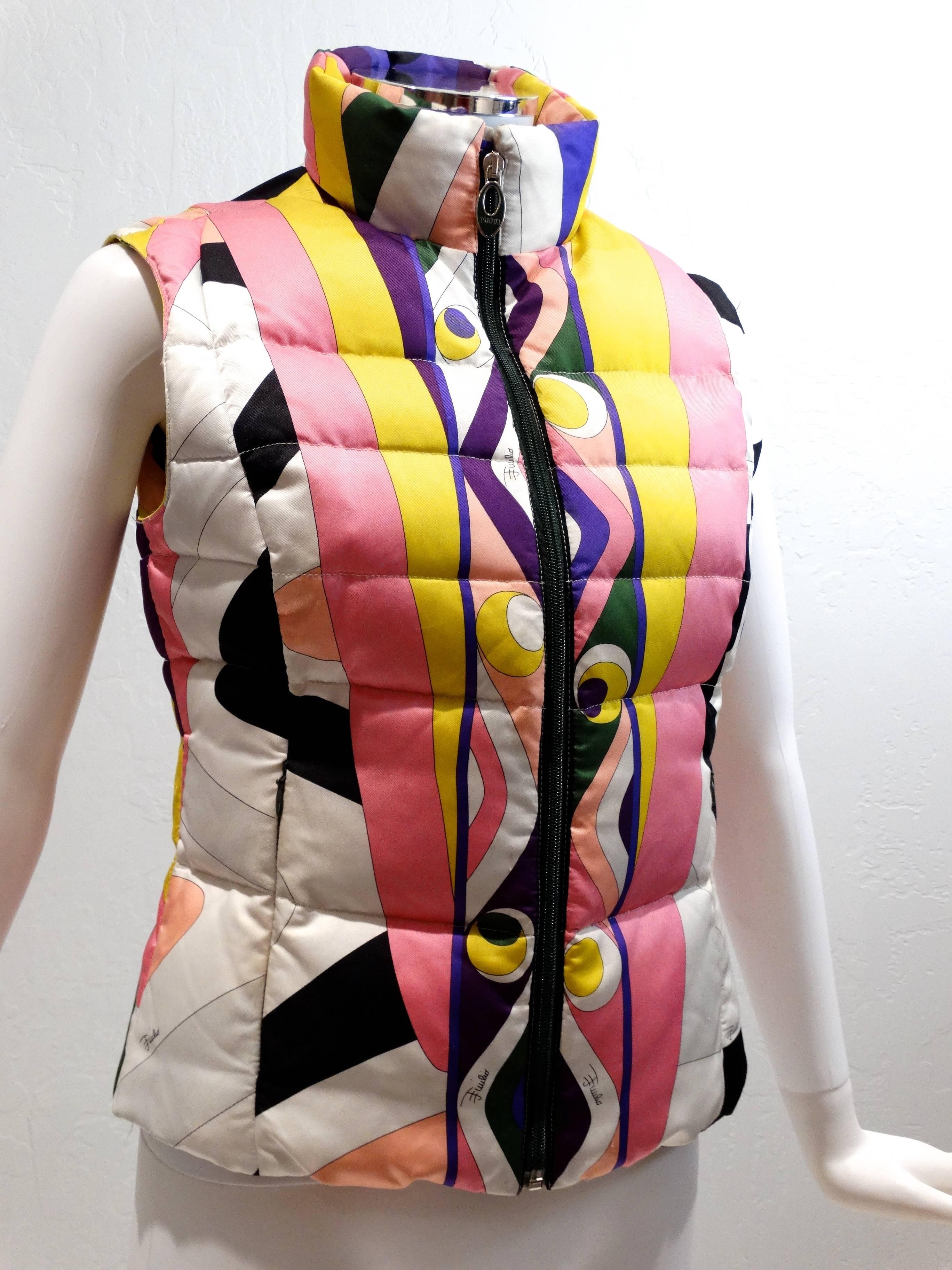 Beautiful 90s Emilio Pucci Geometric-Print Puffer Vest. The puffer vest is done in nylon and features a pink, yellow, white, purple and black abstract pattern throughout with iconic Pucci zip closure, a collar, goode down quilted detailing and a