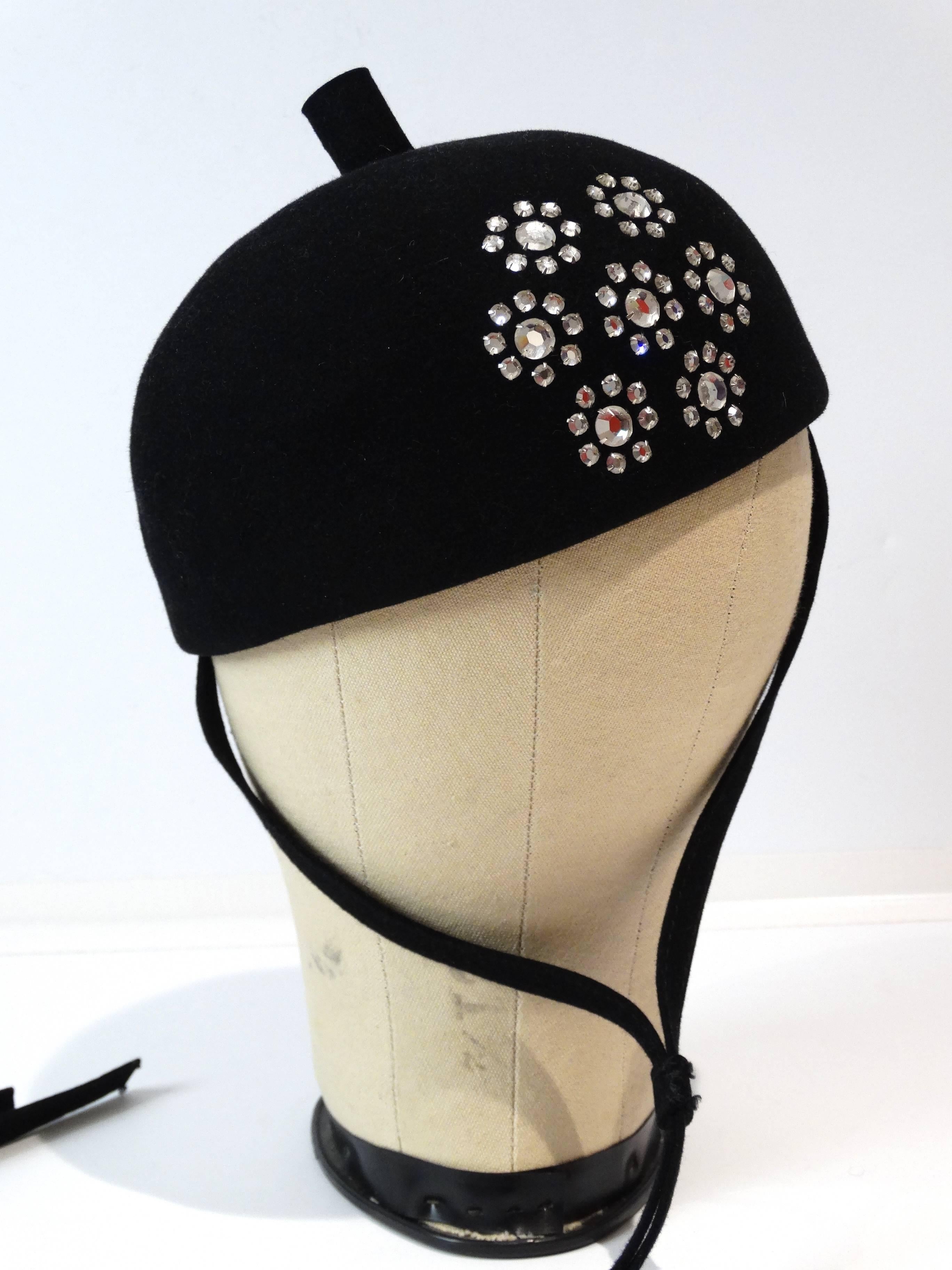 Vintage Adolfo II Paris New York Beret Hat style with Chin Strap. 
Black felt with a large crystal floral design is off centered. A long hanging chin strap adds a great fashion element! 

Approximate measurements. Front to back inside hat 7 1/2