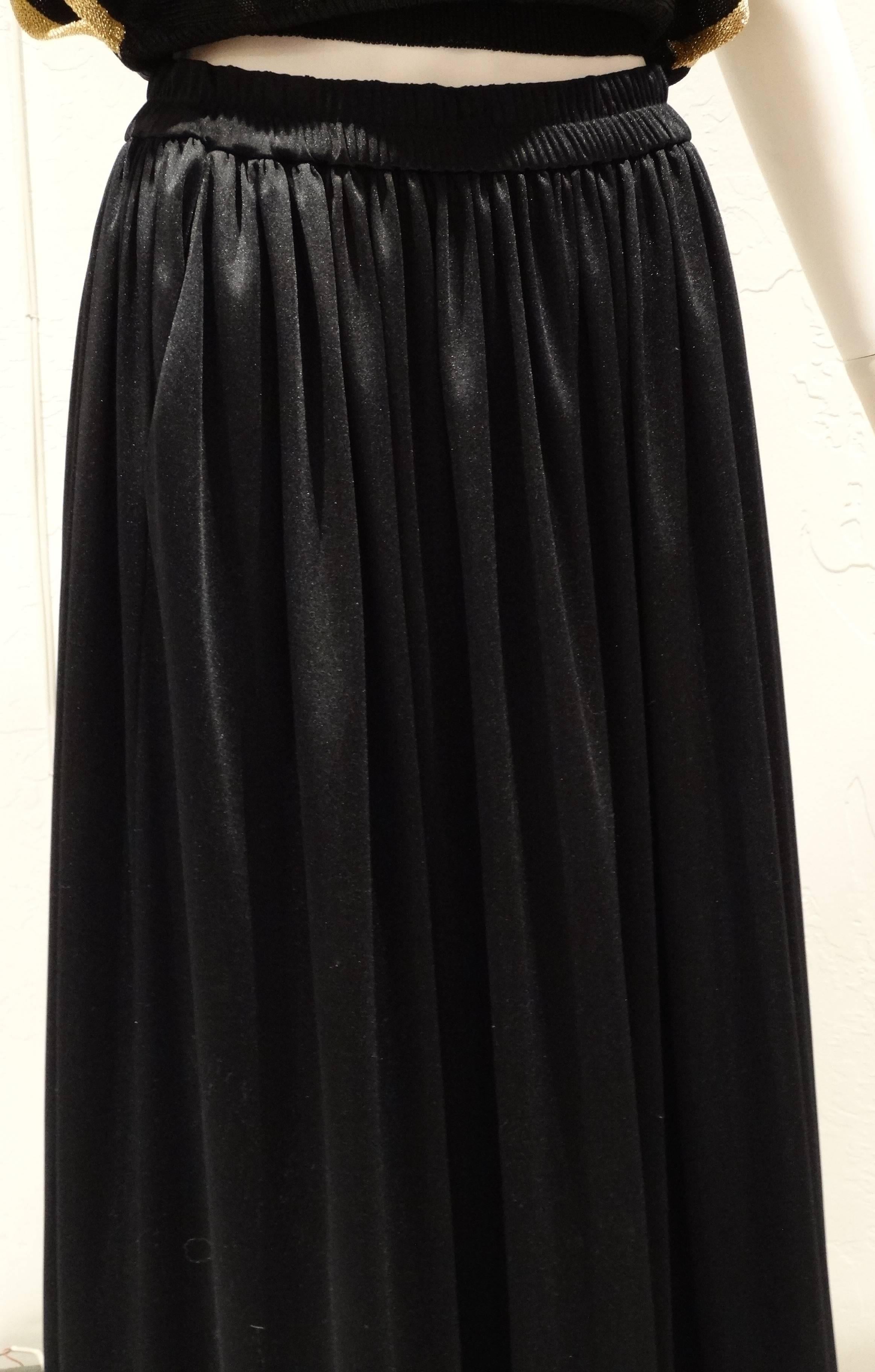 This Saint Laurent skirt is sophisticated, fashion forward, and a piece that will stand the test of time. A vintage masterpiece, protected and preserved in the same condition as it was purchased. This 80's Saint Laurent maxi features a high rise, a