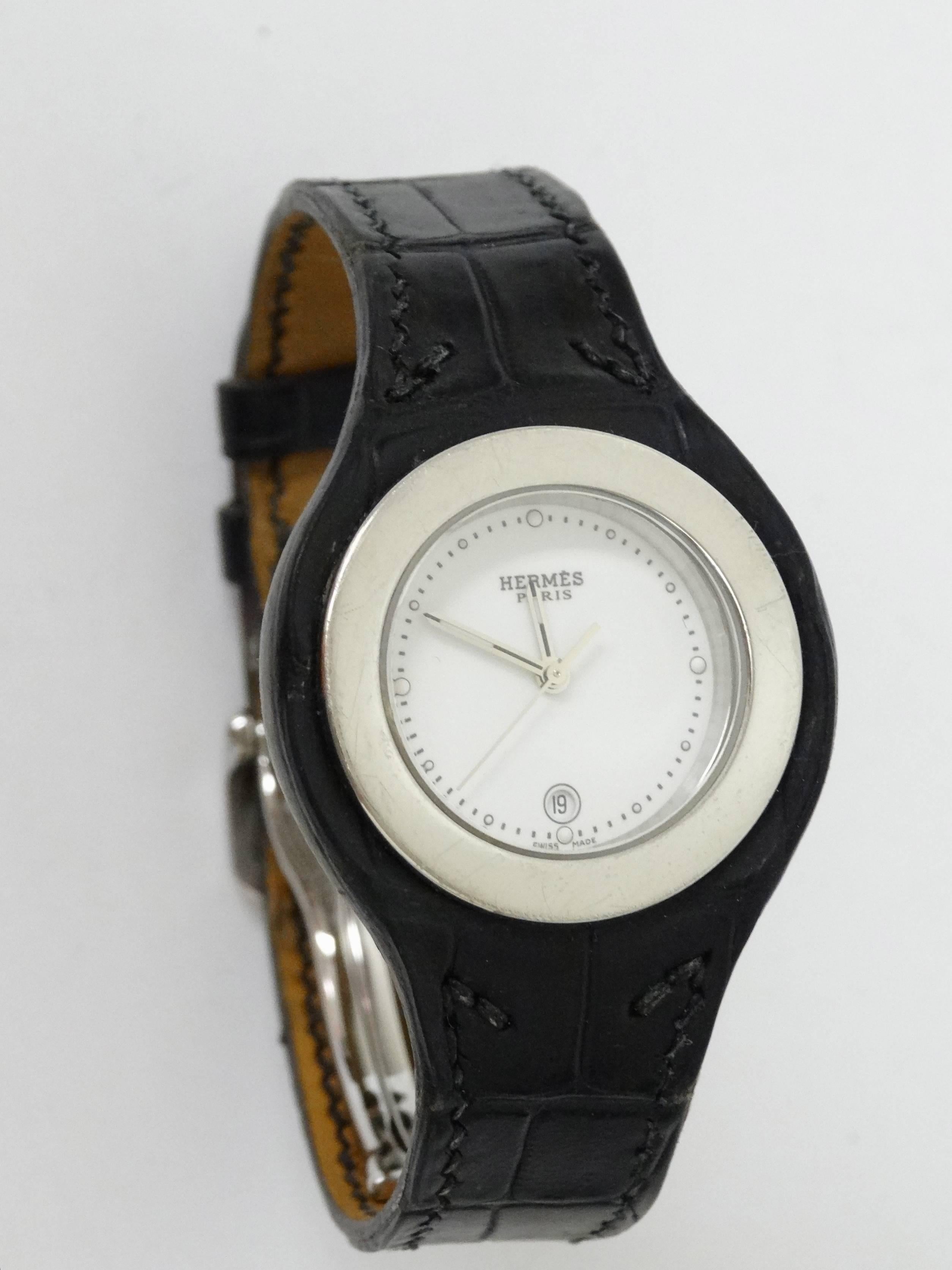 Ladies HERMÈS HARNAIS stainless steel 27mm wrist watch with a jet black gator strap marked Bracelet Hermes. Style Number HA3.210  Swiss made quartz watch with sapphire crystal, smooth bezel, white flat dial, dot hour markers, luminous hands, date