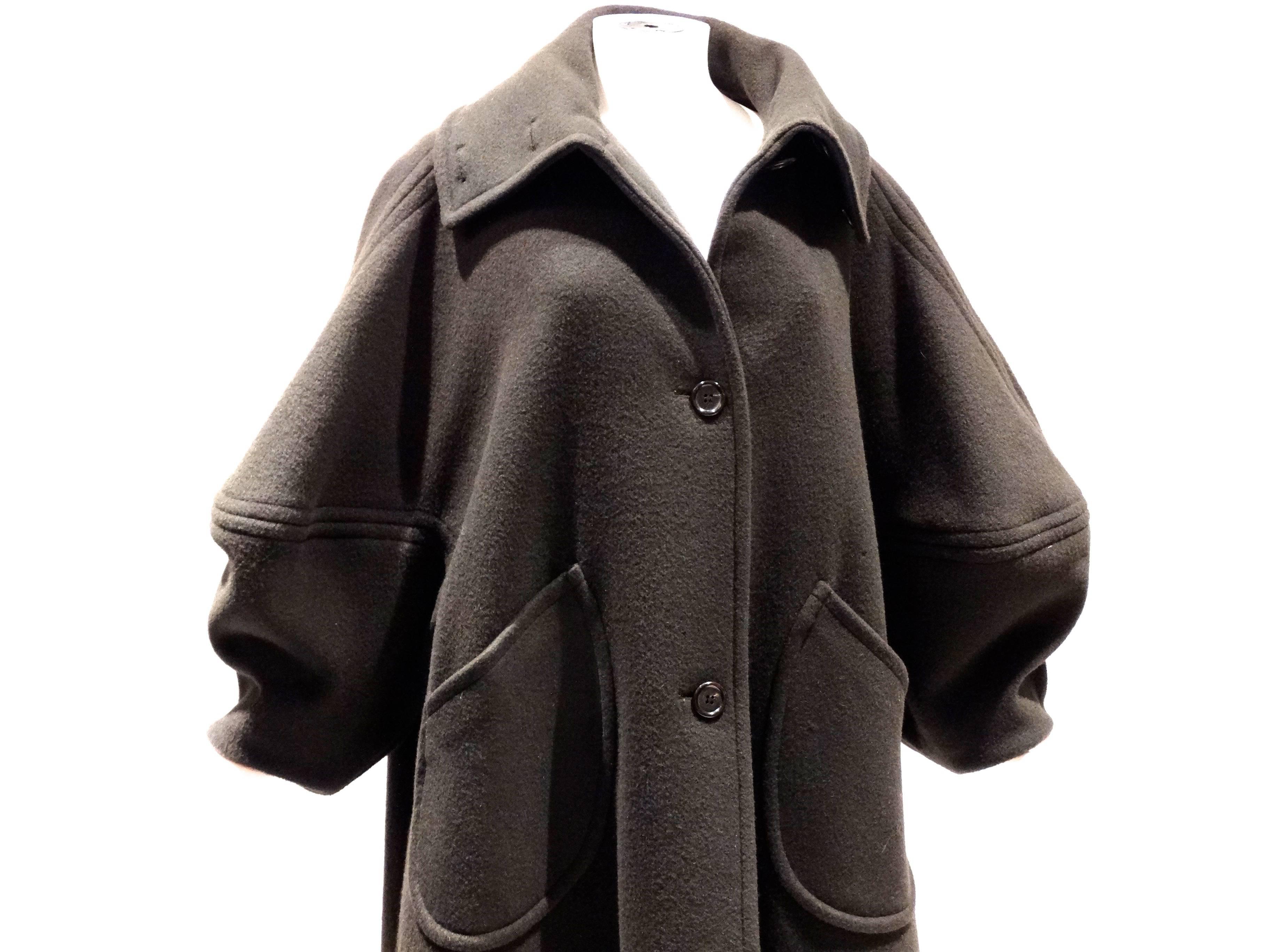 In the perfect shade of olive this 1993 Isaac Mizrahi (what I call batwing) coat is such a special piece. In a heavy wool mohair blend with large oversized buttons, pockets with a large oversized collar to add. Avant garde sleeves gives this coat a