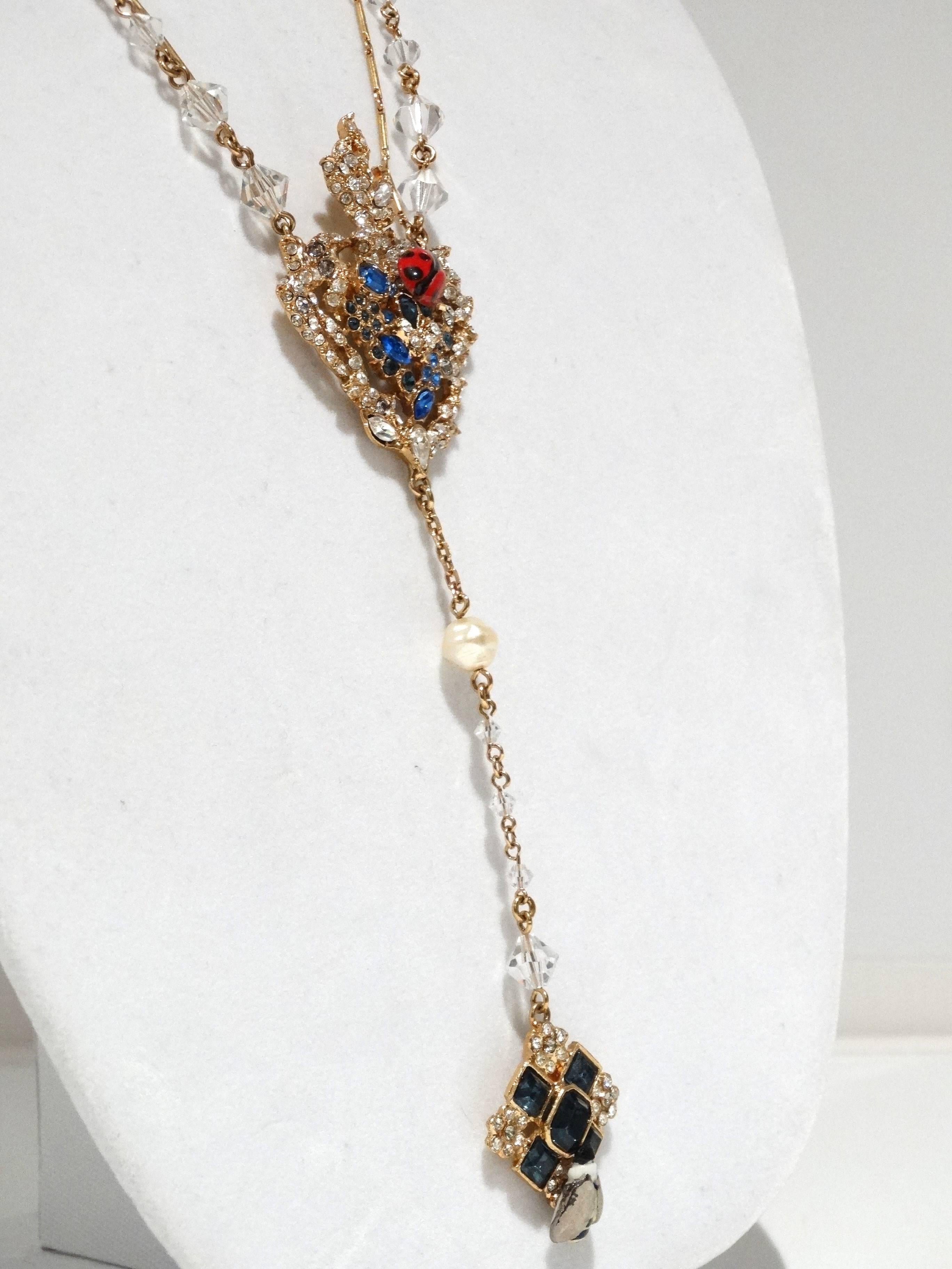 From the house of Lacroix this beautiful two strand necklace is devine. The necklace has a large center pendent which is heart shaped (a signature with Lacroix) with a touch of crystal blue and clear rhinestones enamel ladybug. Off the main center