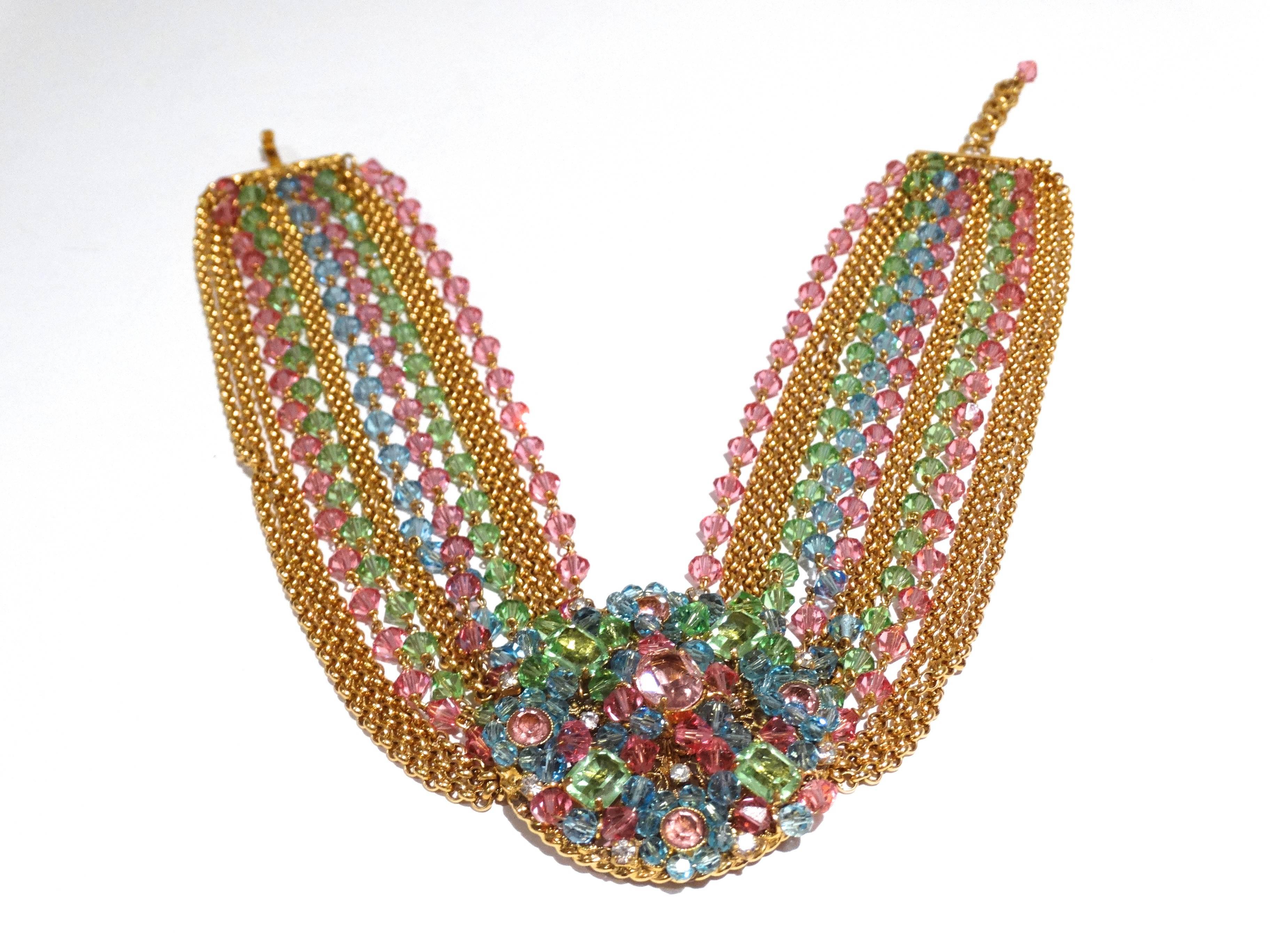 Rare late 70's Chanel multi colored (pink, green,blue and rose) crystal glass collar necklace with large center pendent. Pendent features floral design with 4 large emerald cut crystal stones and multiple clear crystal rhinestones throughout. The