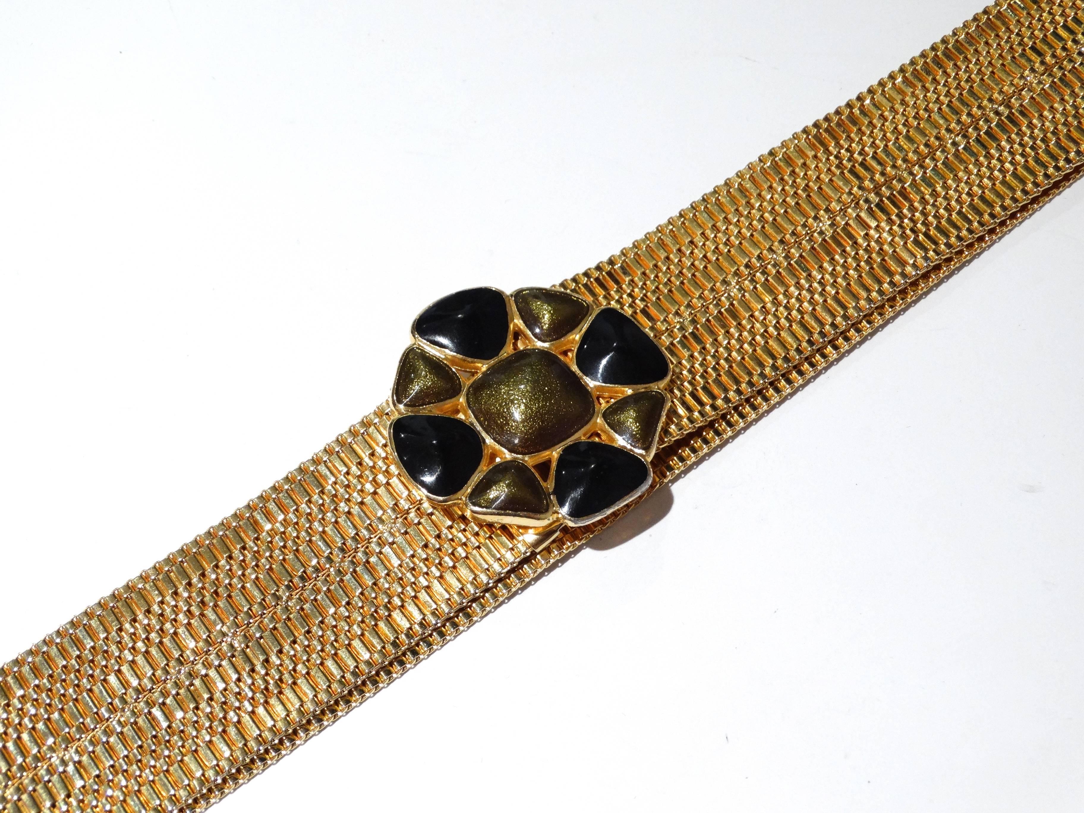 1980's Accessory Accents NYC gold mesh belt with the center pendent buckle, constructed with a pendant-like arrangement of enamel (black and olive green in color). This belt is finished with a hook closure. Pristine, gold tone shiny finish without