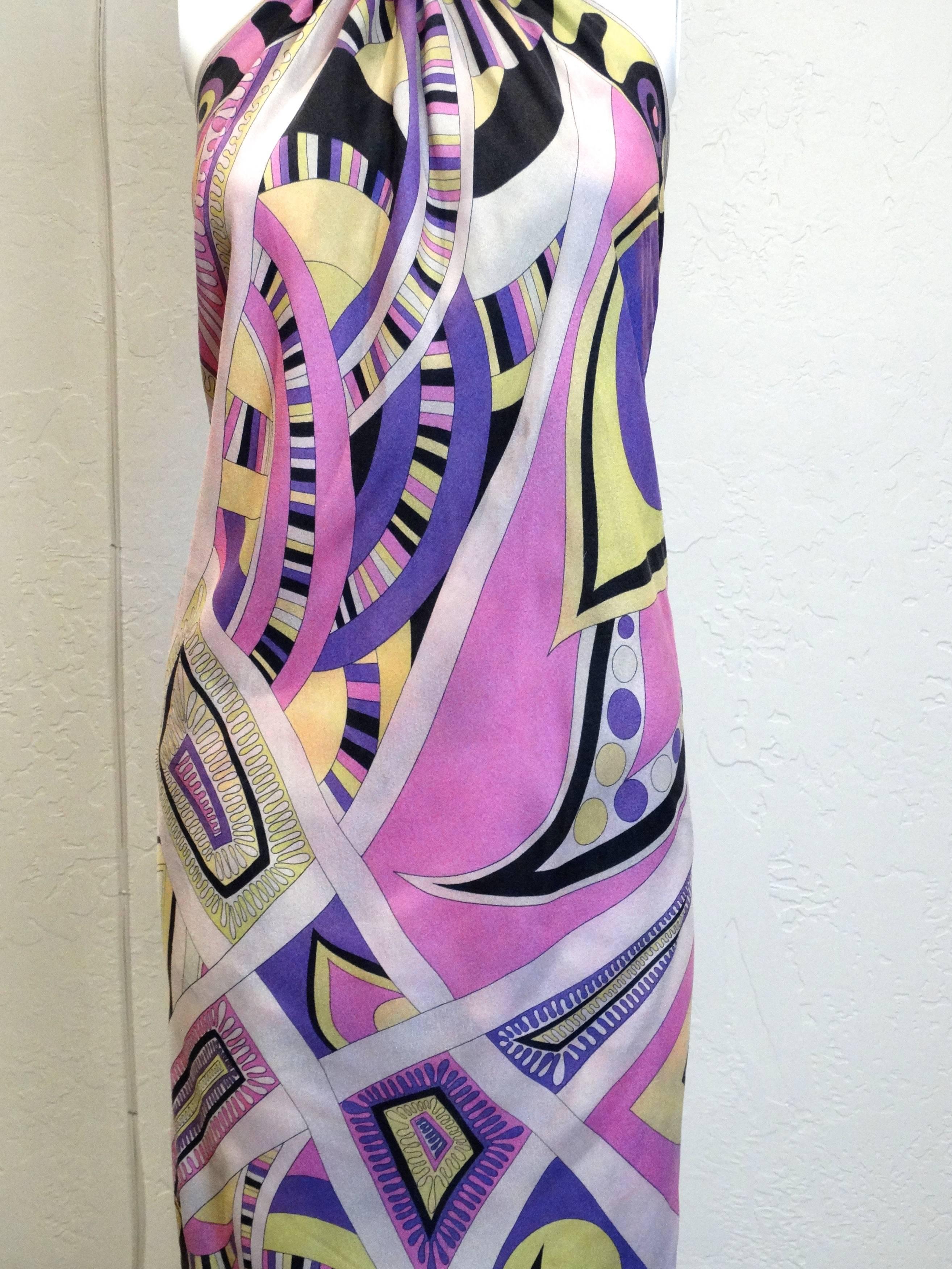 This gorgeous 60's scarf dress made from a large Emilio Pucci silk scarf has one seam for the neck ribbon and one seam at the back to hold the scarf together. (The seam can be easily adjusted for a better fit.) Light as a feather and a perfect