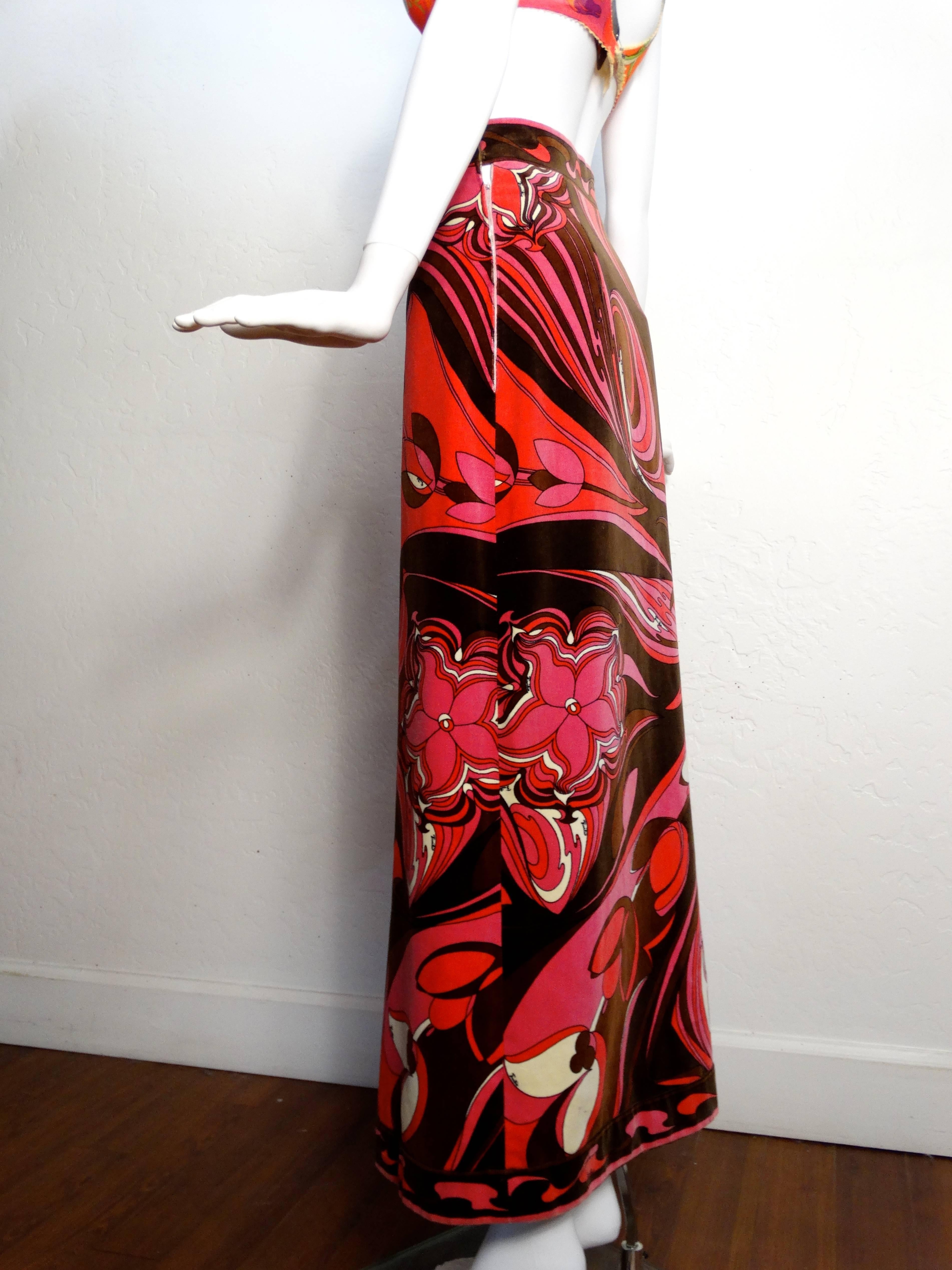 Beautiful 1960's a-line flared velvet maxi skirt by Emilio Pucci for Saks Fifth Avenue. The kaleidoscope graphic print has panels of vibrantly colored abstract prints and florals in pinks, browns, white and red. Side zip entry. Made in Italy.