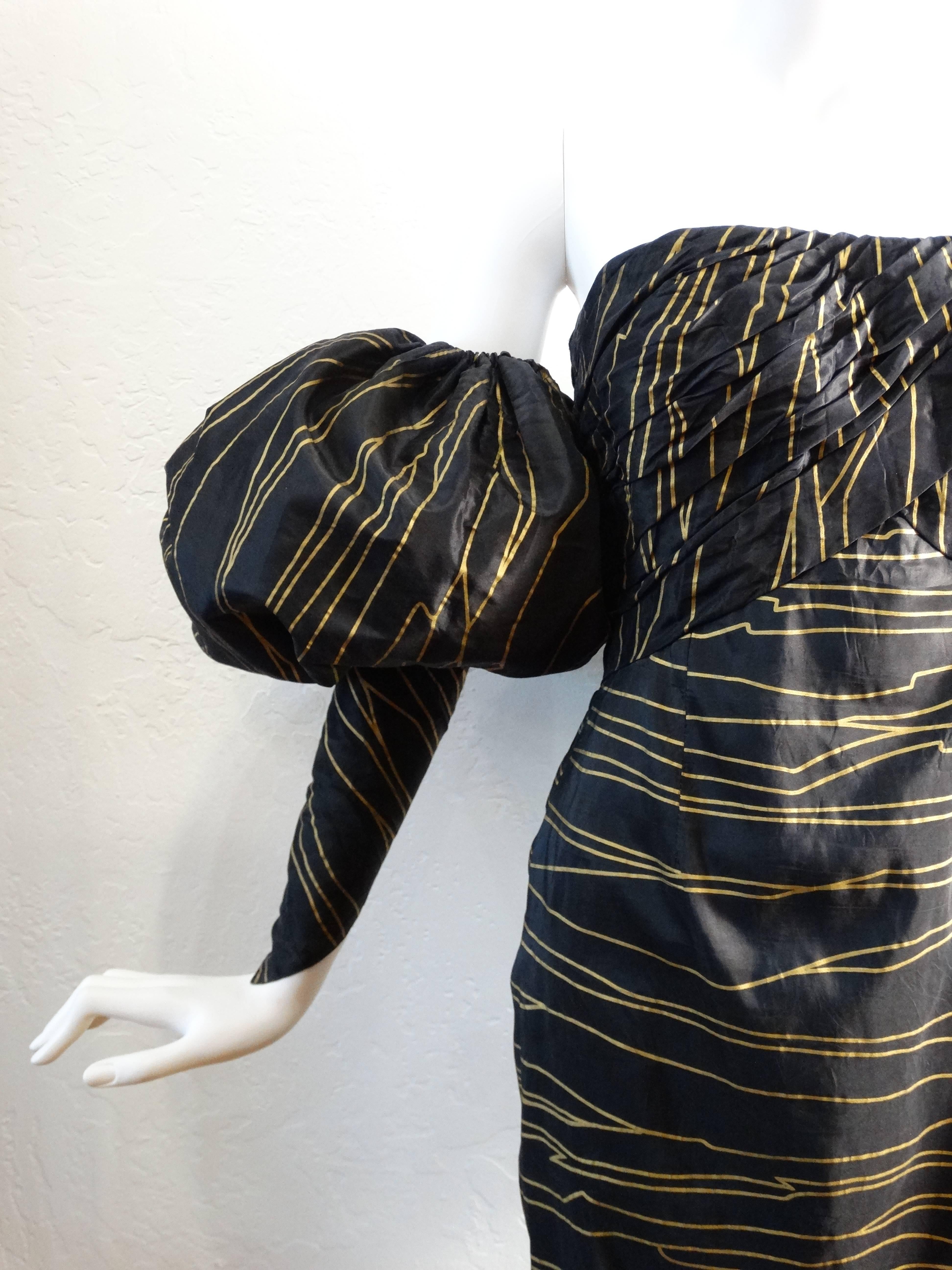 Hello beauty... this is a fabulous early 1990's Chanel couture dress with detachable sleeves. Dress has a metallic gold print, print reminds me of wood grain. This dress is strapless and has a inner corset that zips. The outer corset buttons up with