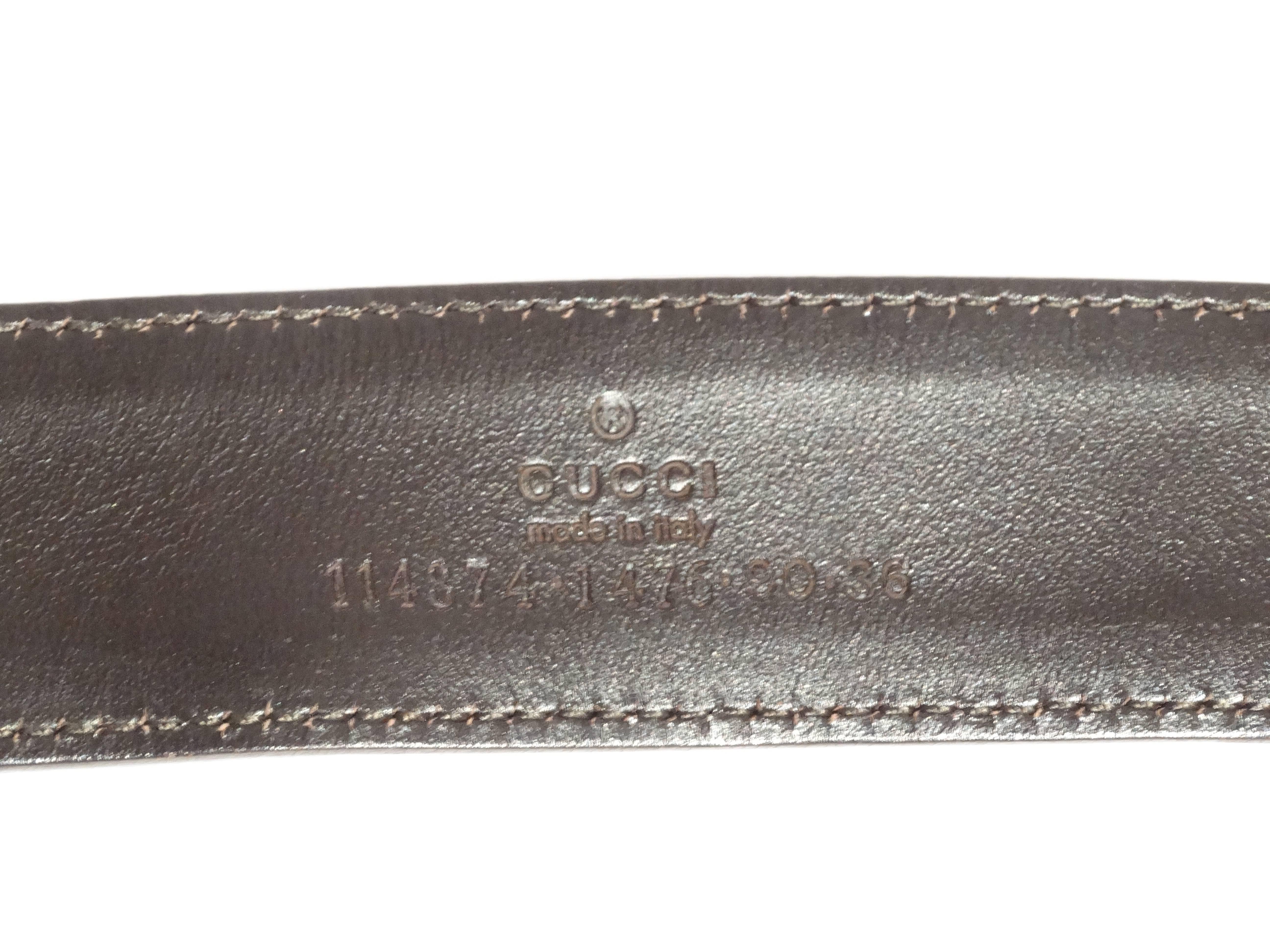 Vintage Gucci belt featuring the signature Gucci fabric and logo buckle. Mint condition with some wear on the buckle (see photos). Wear it with a simple t-shirt and jeans for a chic twist on a classic outfit!

39 1/4