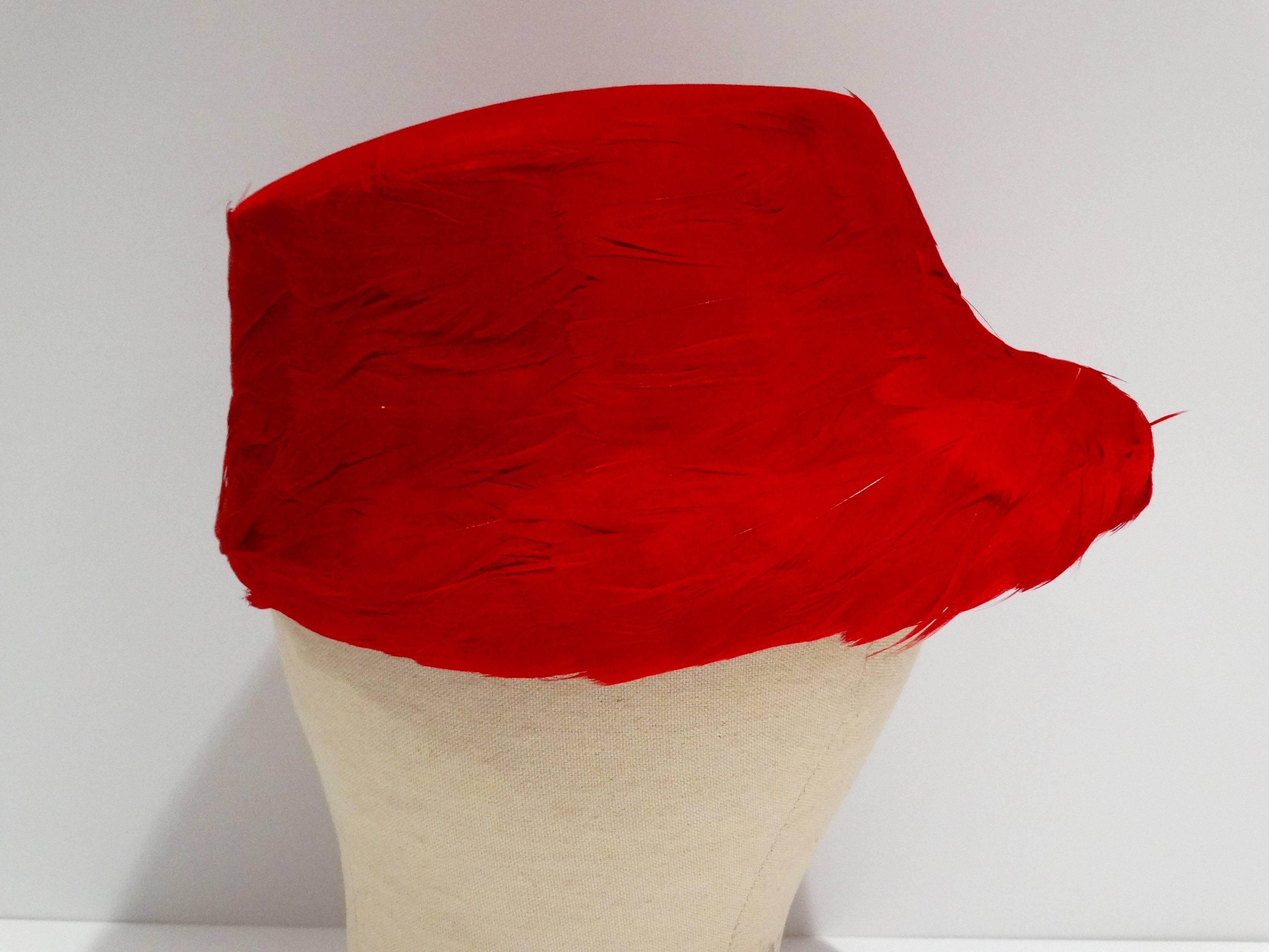 Sassy 1950's Clover Lane feathered hat with felt top. In lipstick red, this hat is very avant guard and looks stunning on. In mint condition Size of the hat...across the top (not counting the brim) it measures 6 1/4