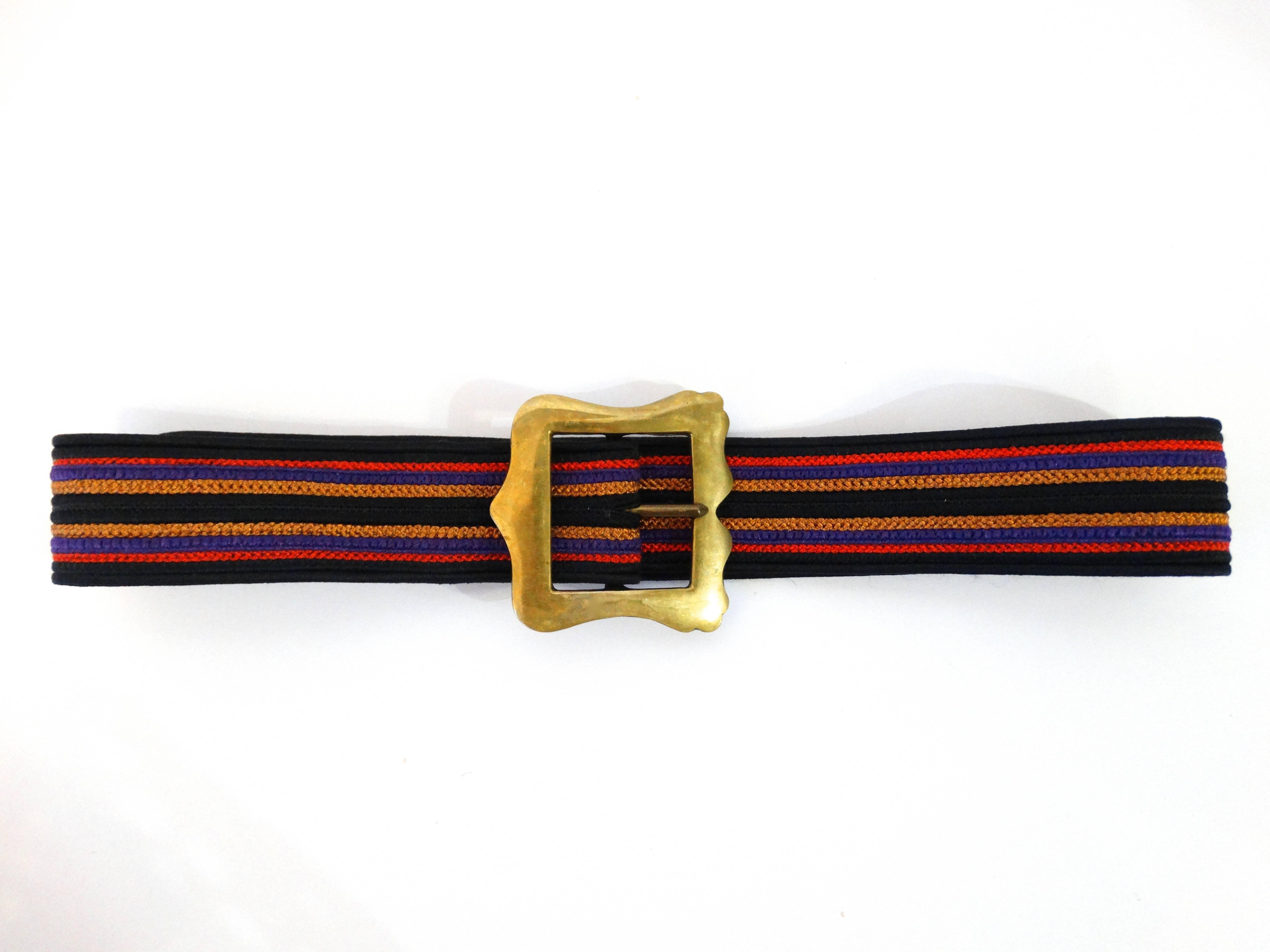 Purple, tan, black and red silk cord belt with large brass buckle. Gold hang tag marked Yves Saint Laurent rive gauche Made in France  
 
Measurements: 
 Width 1.5 inches 
 Belt fits 26 -29 inch waist. 
 May add extra holes to fit smaller if