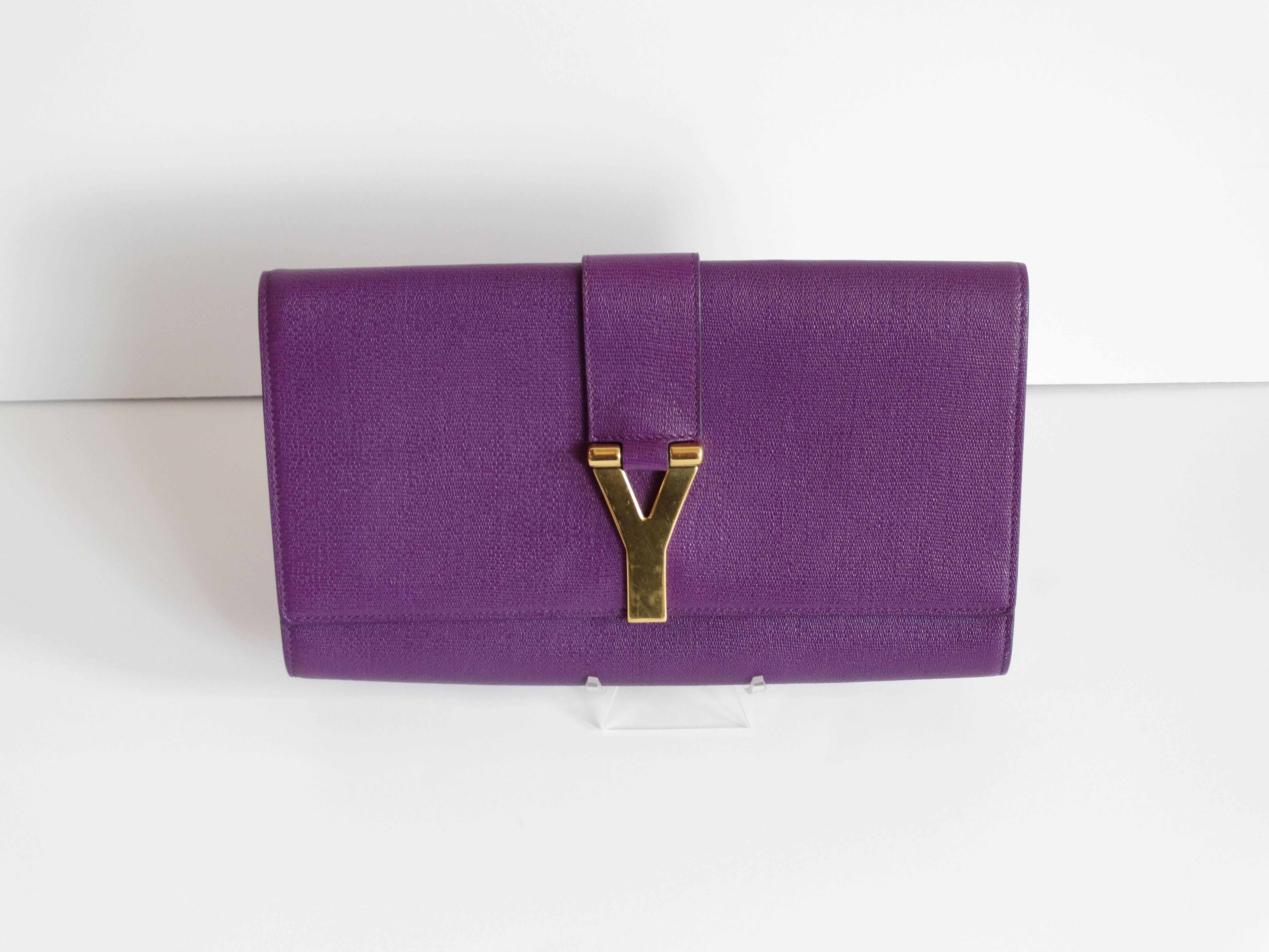 A fabulous YSL Cabas Chyc Clutch bag, flap top closure with goldtone "Y" logo. In mint condition from 2012 this clutch has its original dust bag and paperwork.  Burgundy satin interior lining with one wall pocket. Serial number