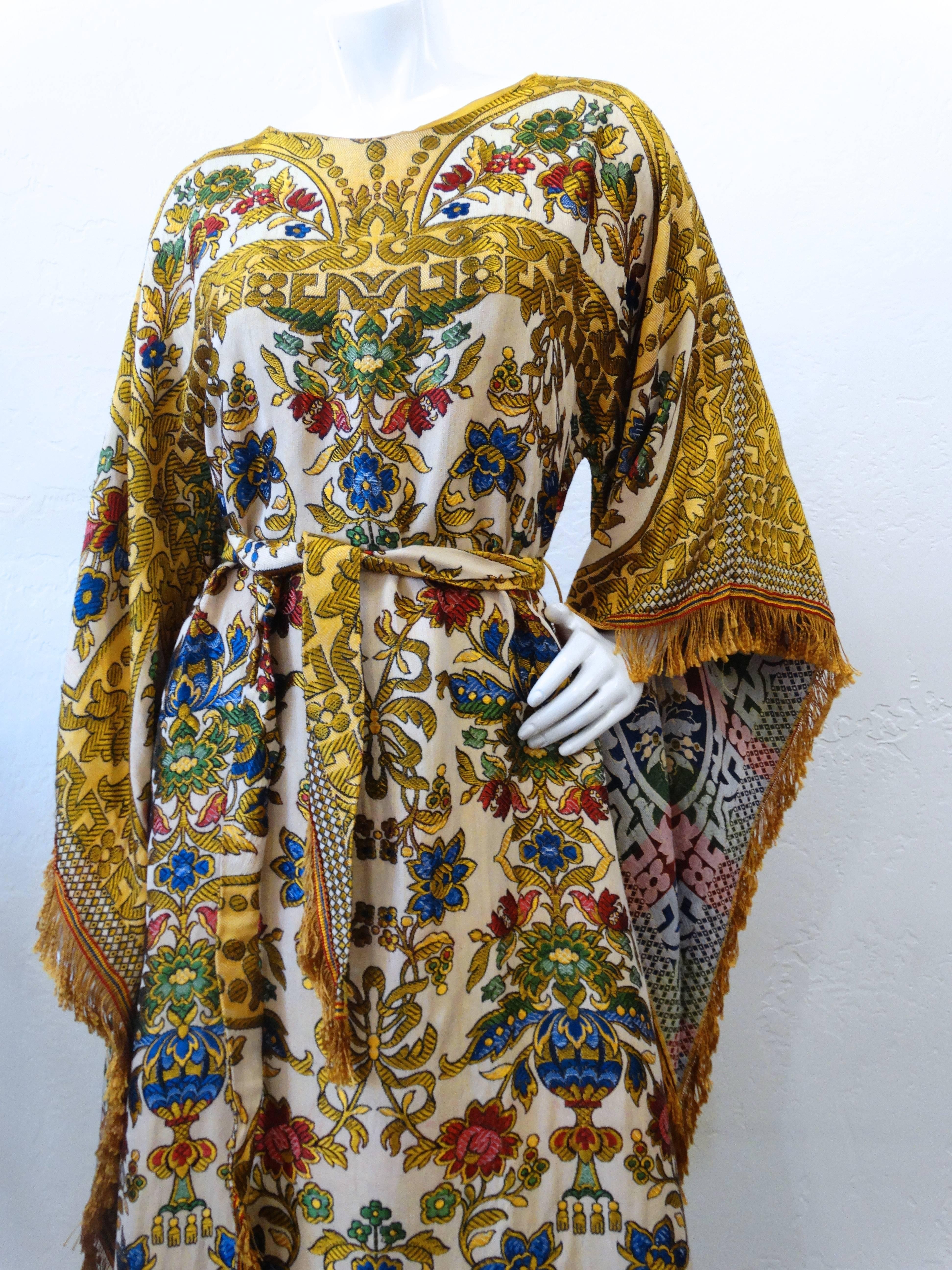 The ultimate 1970's Georgie Keyloun kaftan dress with the chicest tapestry fabric angel wing sleeves. sz M/L style #9032. Has fabric belt and back zipper plus side pockets. Beautiful silk fringe trims the sleeves and hemline. 

 Very good condition,