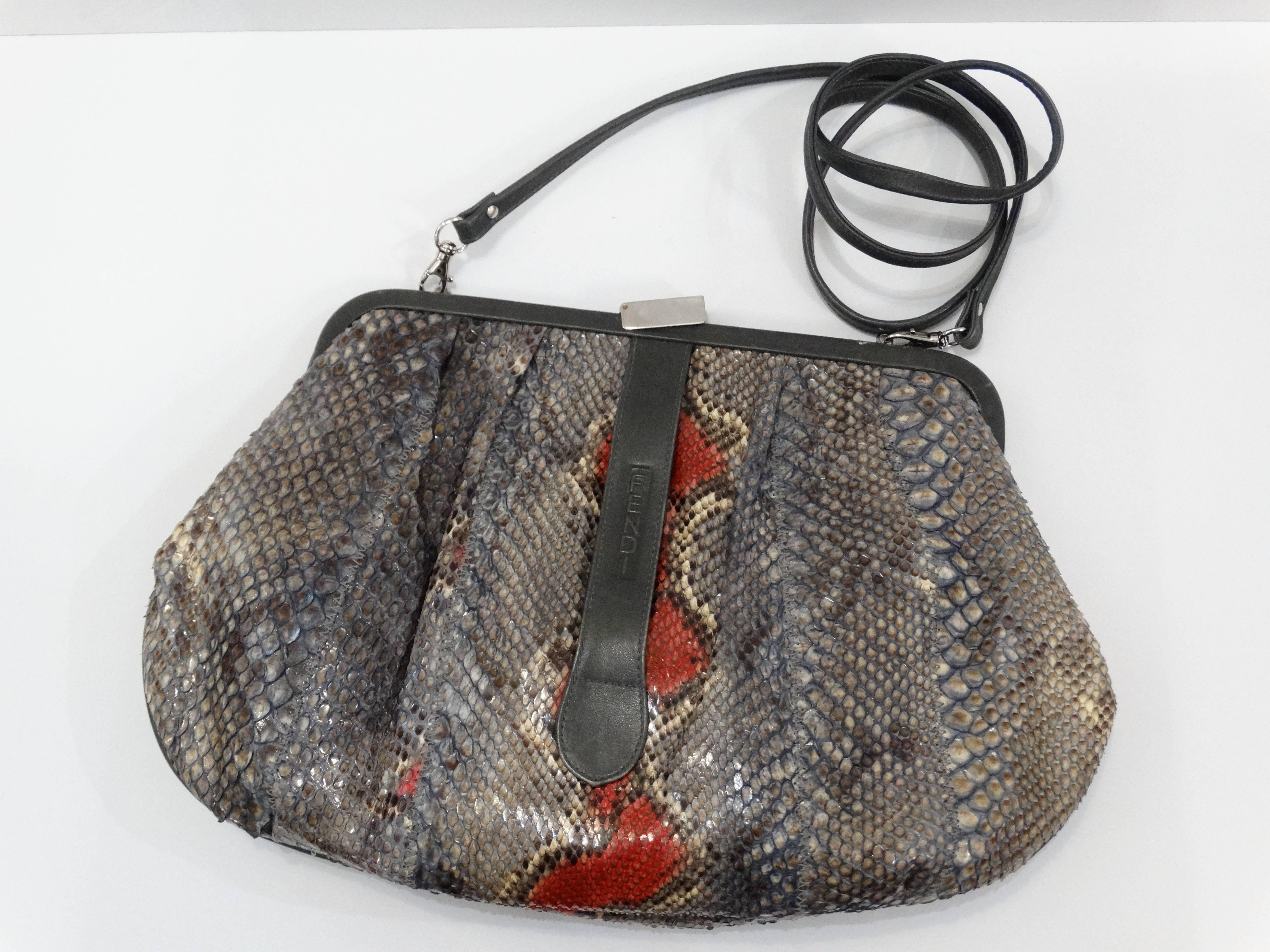 Incredible 1980s Fendi snakeskin clutch handbag in grey and red with grey leather accents. Fully lined interior with zip pocket. Tuck in the long strap to wear as a clutch or wear as crossbody.  Top frame secured with a silver clasp, minor wear on