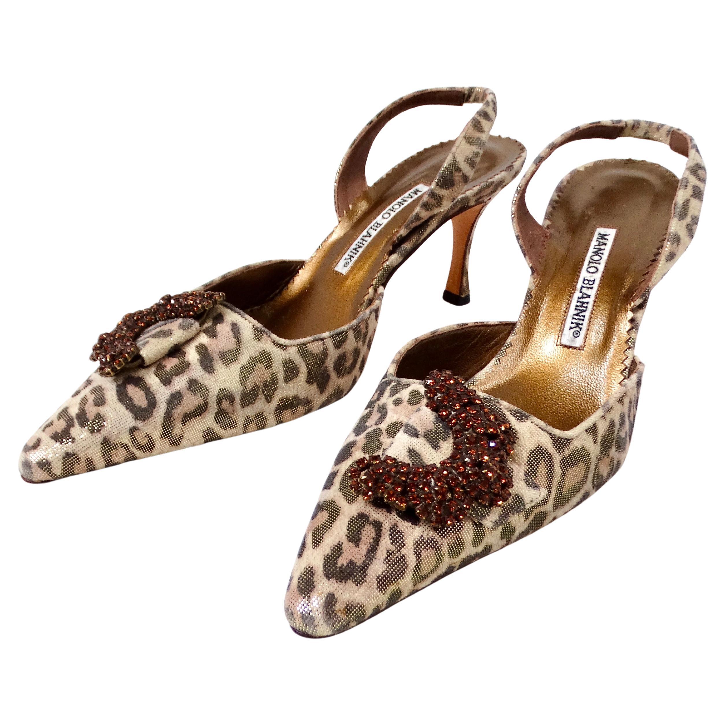 The Manolo Blahnik Metallic Leopard Print Suede Slingback Pumps circa Y2K are a striking example of late 1990s to early 2000s luxury footwear. Crafted from luxurious suede, these pumps feature a bold metallic leopard print that exudes both glamour