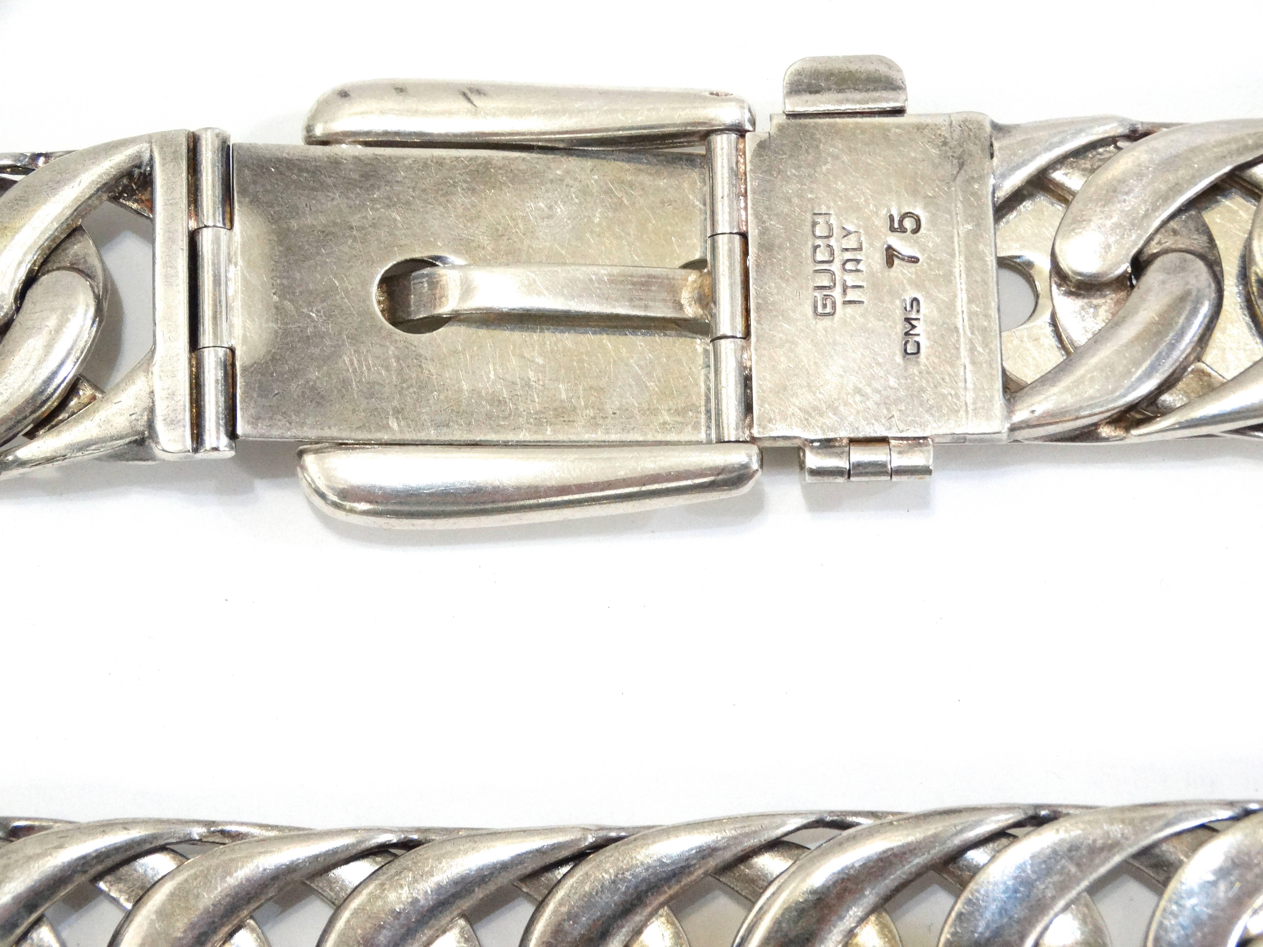 Rare 1970's Gucci chain belt cast in sterling silver- this piece has some weight to it! Traditional belt buckle style with thick flat chain strap. Signed Gucci Italy 75 CMS

The belt chain measures 36 1/2