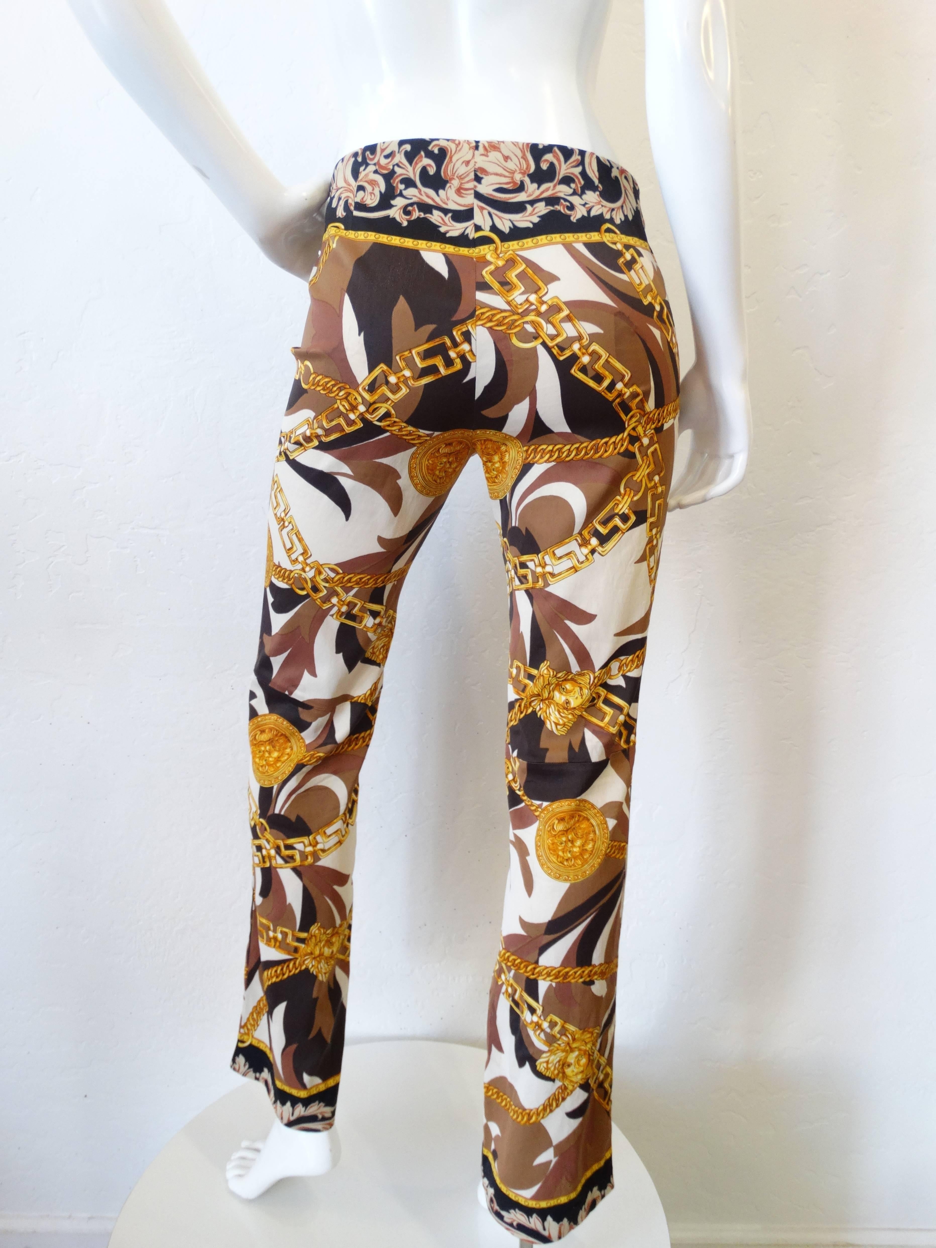 Fabulous pair of late 80's GIANNI VERSACE Jeans Couture Trousers/Pants.
Slightly elasticated fabric which hugs the body nicely, the pants are mid-rise, fabric has a abstract prints with Lion and Medusa head printed details with iconic Versace chain