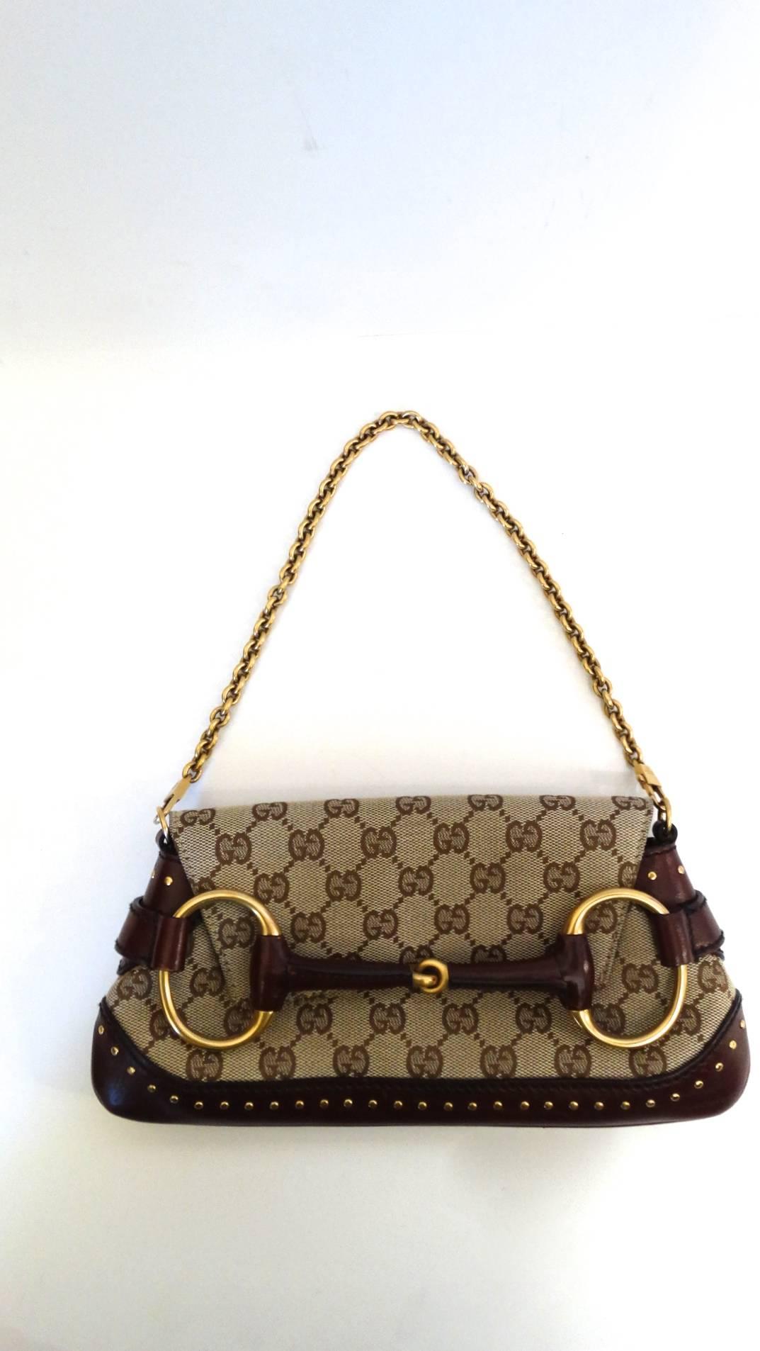 Tom Ford for Gucci, Gucci Monogram horsebit chain shoulder bag from their F/W collection circa 2003. Purse can be converted into a classic clutch with removable gold chain strap. Comes with dust bag. 

Length: 10