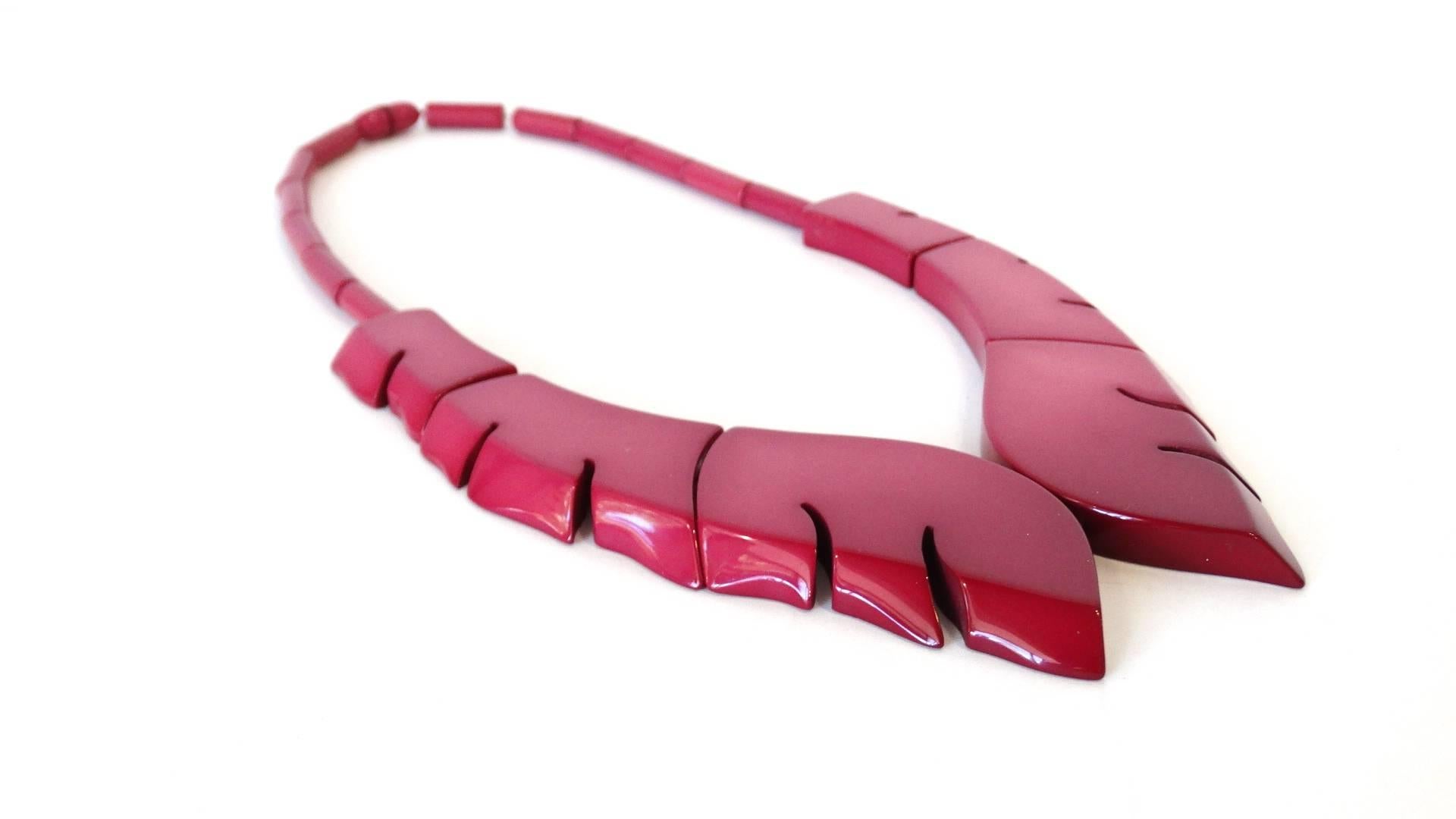 The most amazing 1970s bakelite necklace from none other than Guillemette L'Hoir Paris- designer of avant-garde art inspired jewelry made from Galalith. This piece is made out of ombre magenta bakelite, arranged in a wavy, collar like structure.