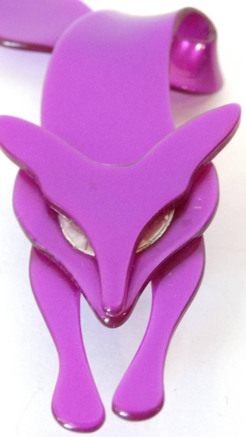 Are you the Foxiest of them all? Beautiful Fox pin/brooch Designed by French artist Lea Stein, this vintage, one-of-a-kind crawling fox dates to the late 1970's.The perfect fashion addition in Foxy Iridescent Magenta with Silver Eyes 100% celluloid