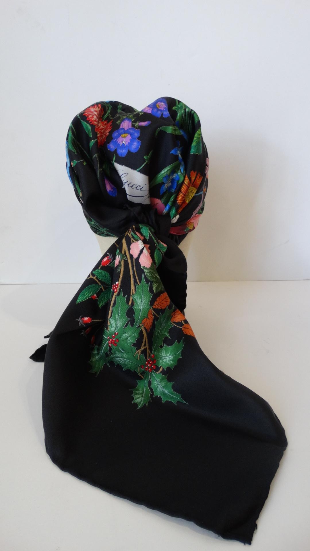 Who doesn’t love a little vintage Gucci Flora? Incredible black silk scarf printed with Gucci’s signature multicolored “Flora” floral print! “Gucci” printed in cursive in the bottom corner of the flowers. The size of this scarf allows for a number