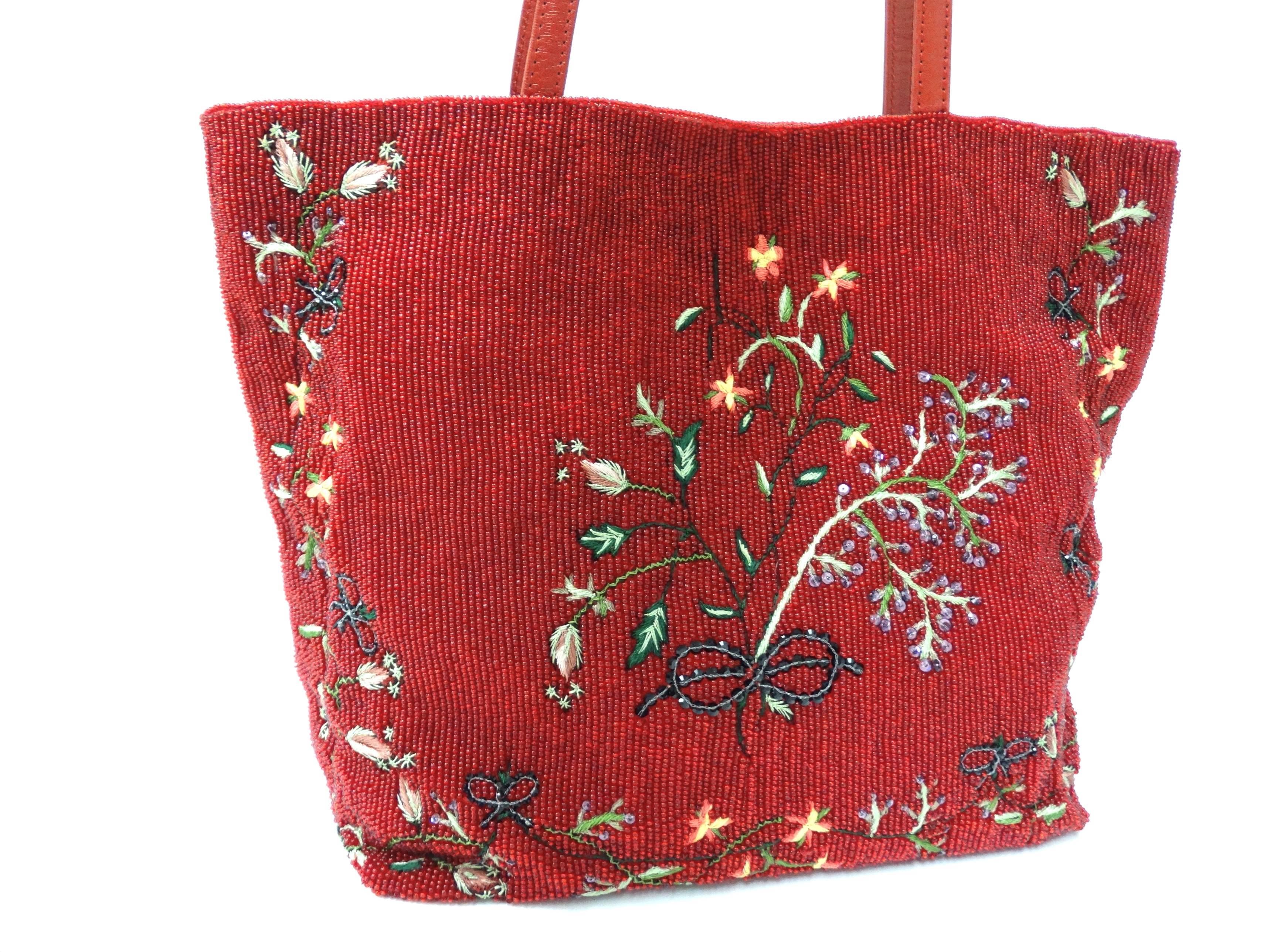 A beautiful and rare Valentino embroidered and beaded tote handbag designed by Maria Grazia Chiuri & Pierpaolo Picciol for Valentino's 1999 collection. LABELED 'VALENTINO GARAVANI'This tote is embroidered and covered in Valentino red glass beads