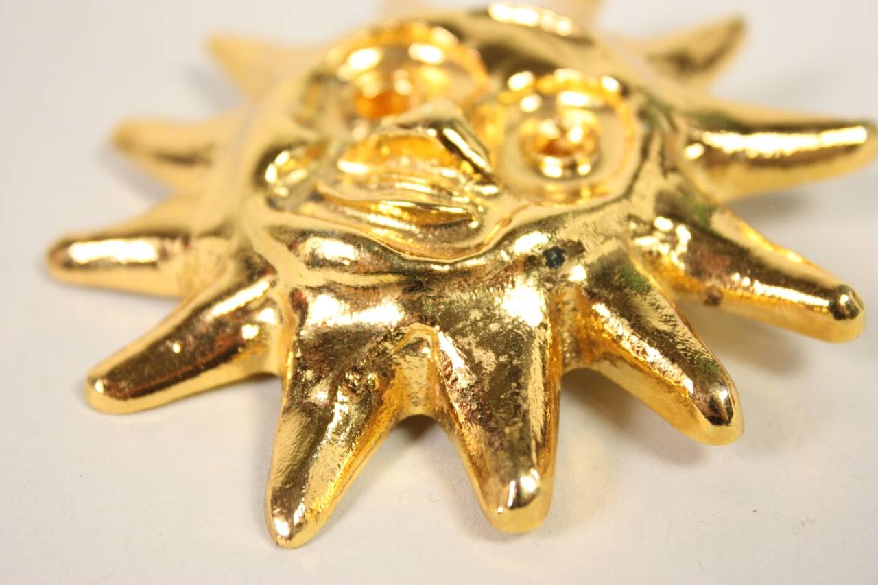 Gold-toned sunburst brooch from Christian Lacroix likely dates to the 1990's.  It measures 3