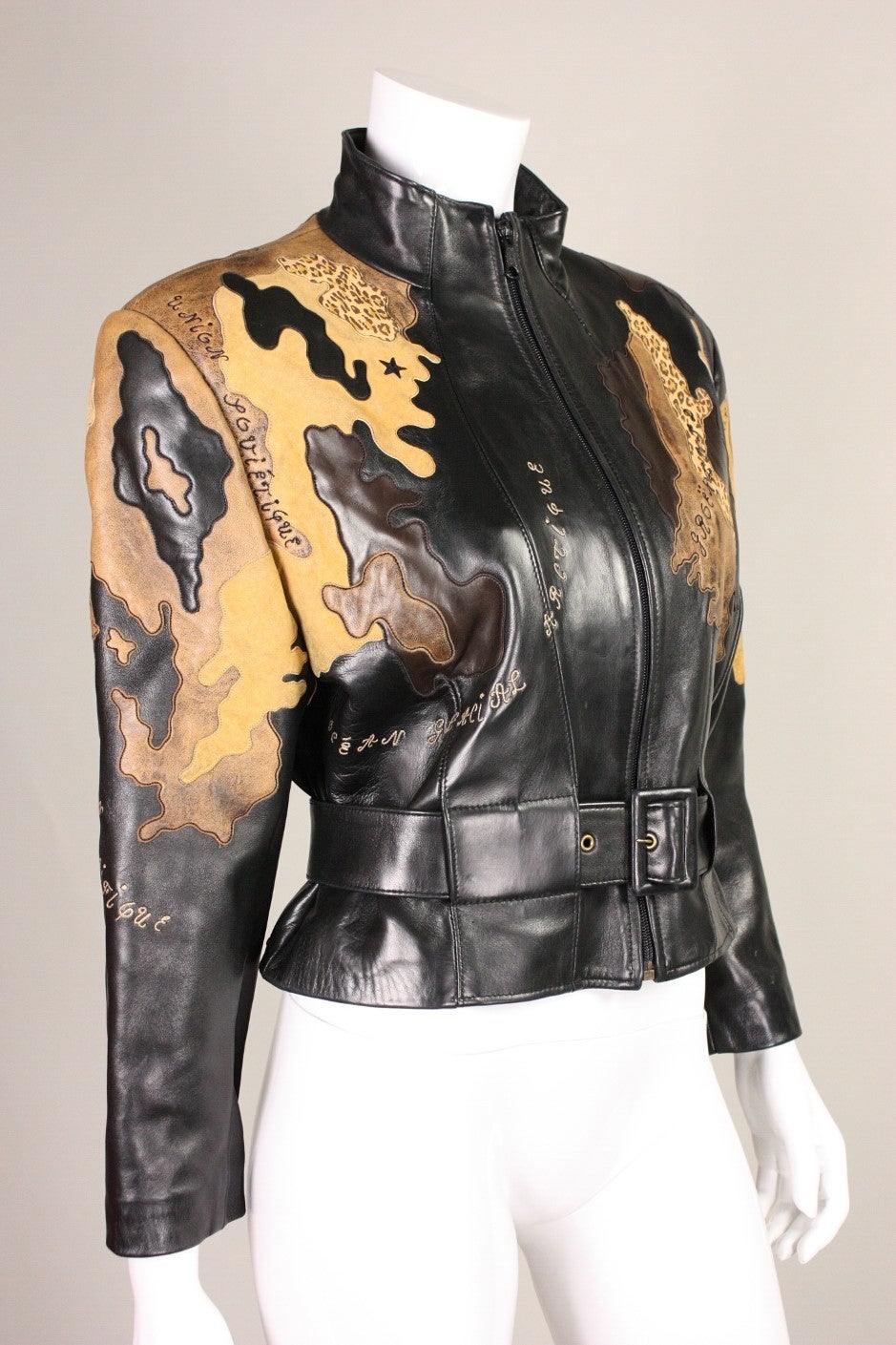 Superb jacket from Jean Claude Jitrois dates to the 1990's and is made of buttery soft leather with a map of the world appliqued on.  Stand collar.  Fully lined.  Belted waist. Center front zipper.

Fits a size 4-6 US.