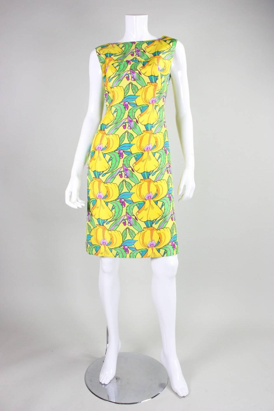 Vintage dress from La Mendola dates to the 1960's and is made of yellow silk with a polychromatic floral print. High front neck with v-neck back.  Shift-style.  Back zipper in skirt.  Fully lined.

No size label. Best suited for US 6-8. 