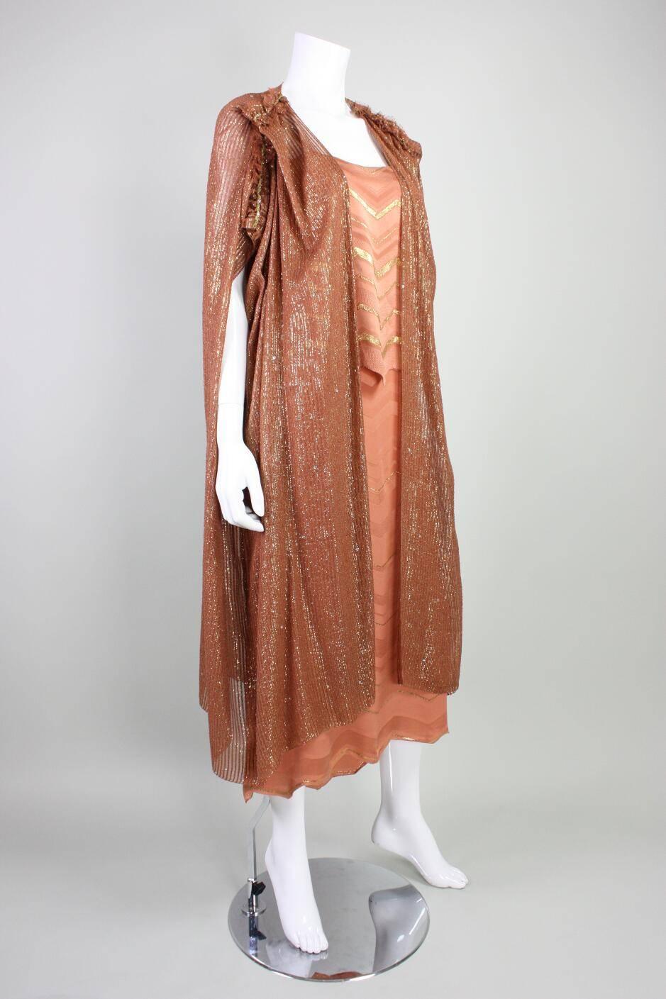 Vintage dress with cocoon coat from Holly's Harp likely dates from the late 1970's to the 1980's.  The dress is made of what feels like silk with a lamé stripe and the coat is made of a chiffon, likely silk, with self stripe.  The dress has a