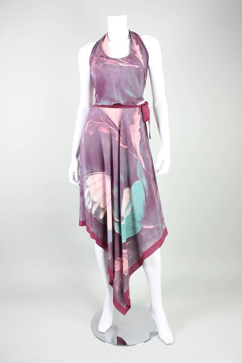 Vintage ensemble dates to the 1970's and is made of mauve silk with a butterfly and leaf print that was designed by R. Meciani.  Halter top ties at back neck and back waist.  Skirt features handkerchief hem and ties at side waist.  Both pieces are