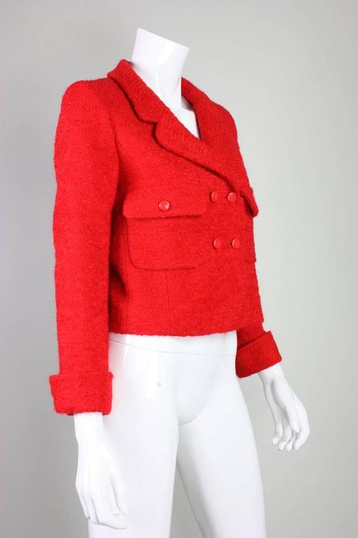 Vintage jacket from Chanel dates to 1997 and is made of a rich tomato red wool/mohair bouclé.  Jacket is single-breasted with over-sized patch pockets.  Button closures.  Fully lined in silk with interlocking C's.

Condition:
