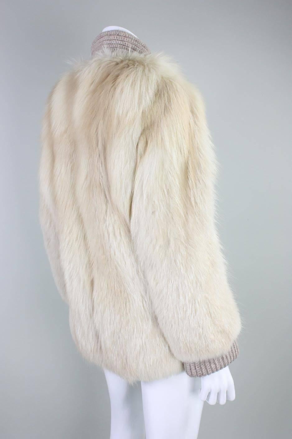 Vintage sweater jacket from Edwards-Lowell Furs likely dates to the 1980's and is made of dark cream fox fur pelts with taupe knitted collar, cuffs, inner sleeves, and placket. Center front button closure.  Fully lined.