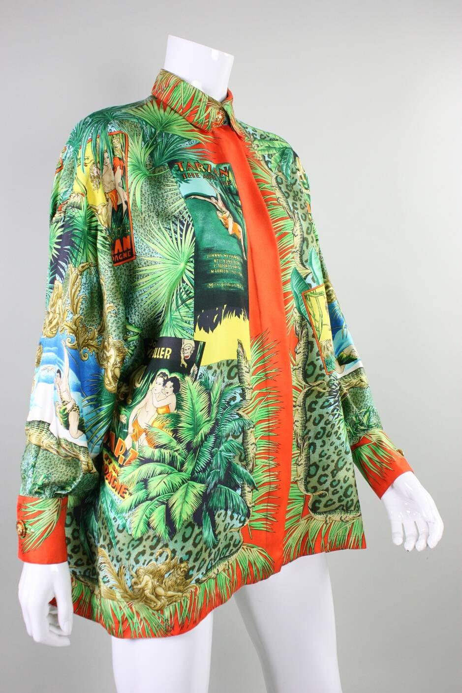 1993 Gianni Versace blouse is made of silk twill and features the iconic Tarzan motif. Gold-toned Medusa buttons with orange enamel at neckline and cuffs. Center front lapped button closure. Unlined.

Label size 38; however, garment is meant to be