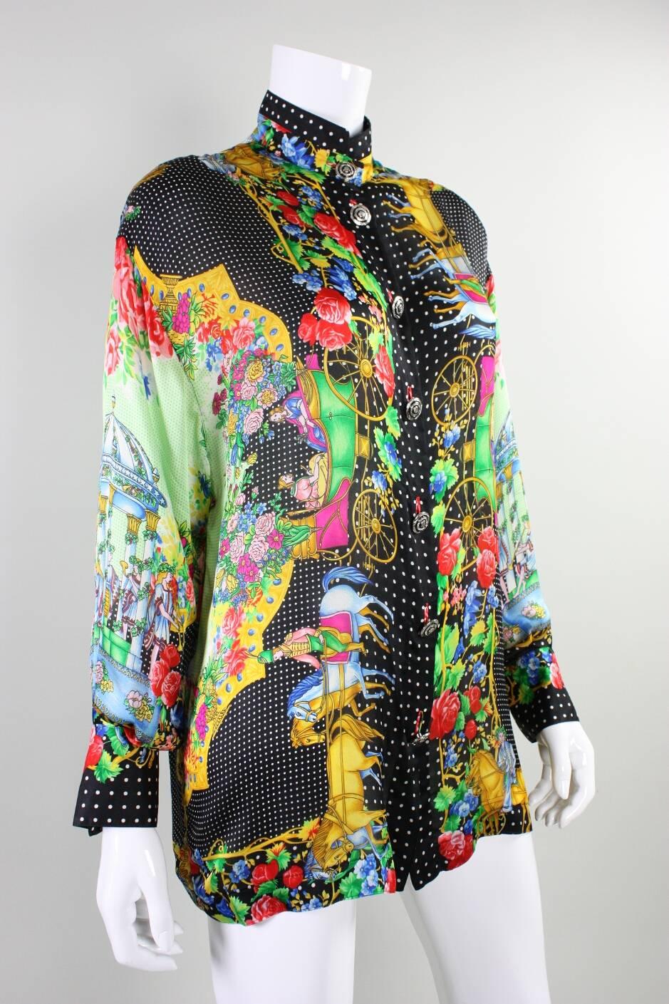 1990's Gianni Versace Couture blouse is made of silk charmeuse and dates to the 1990's. Blouse is multicolored and has a varying motifs. Center front silver-toned Medusa buttons with black enamel. Matching buttons at cuffs. Unlined.

Labeled size