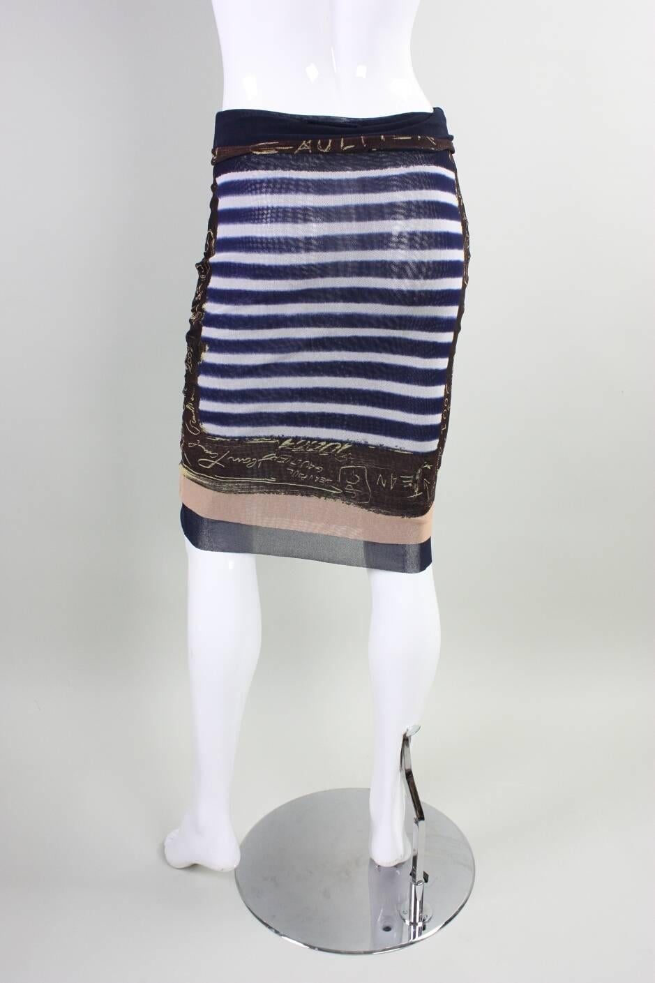 Jean-Paul Gaultier navy & white striped skirt dates to the early 2000's and is made of 100% nylon netting.  Fold over waistband.  No closures.  Lined with same stretch fabric.

Labeled size Medium.

Condition: Excellent.

Measurements-

Waist: