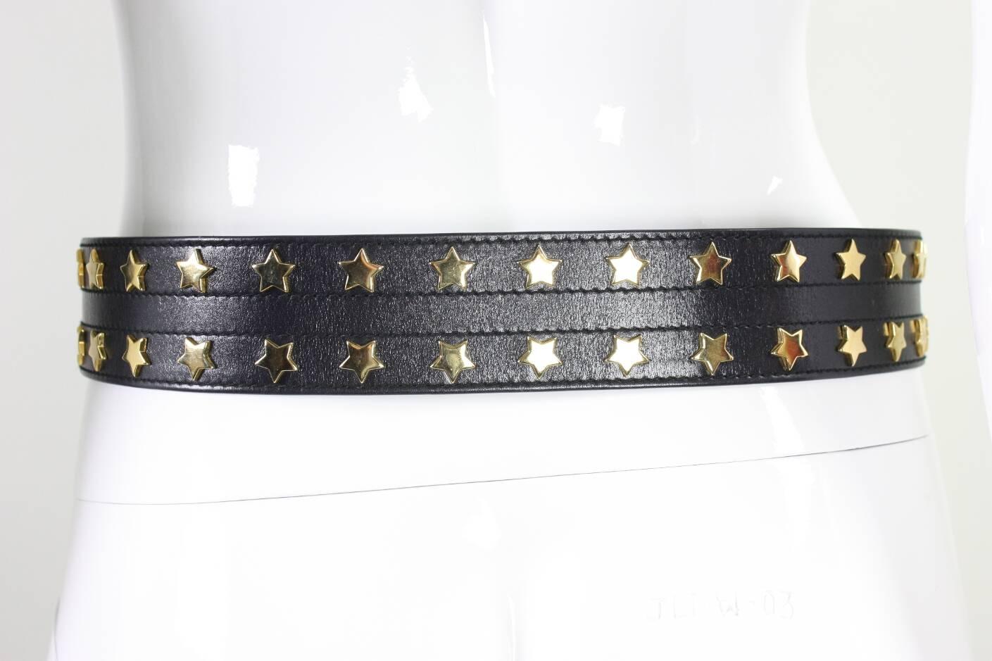 Vintage belt from Escada likely dates to the 1980's and is made of soft black leather with gold-toned stars.  Made in Italy.

Labeled a size 40.

Measurements:
Waist Length: 31-33