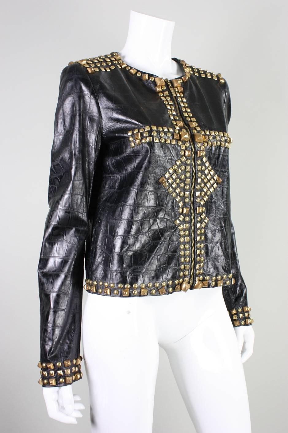 Contemporary embossed black leather jacket from Roberto Cavalli's Just Cavalli line features gold-toned pyramid studs. Round neck.  Center front zippered closure.  Fully lined.

Labeled a size 44.

Measurements- 
Bust: 38