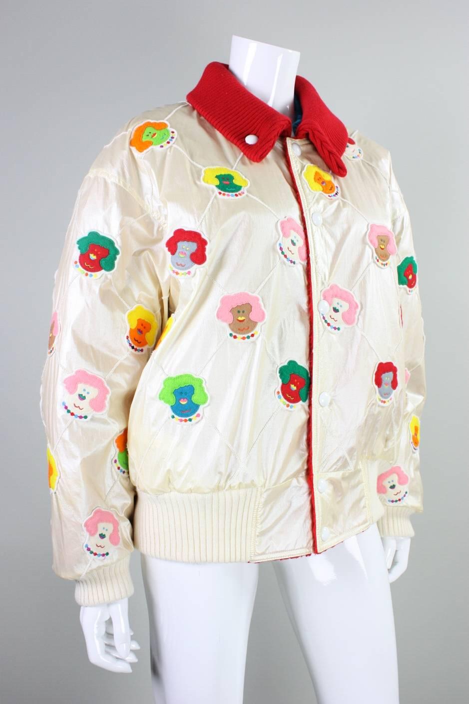 Vintage Jacket from K Factory by Nobuo Ikeda dates to the 1980's and is made of an ivory synthetic fabric with felt clowns appliqued throughout.  Red ribbed collar can be snapped down or worn up.  Ivory ribbed cuffs and hem.  Lined with red fleece. 