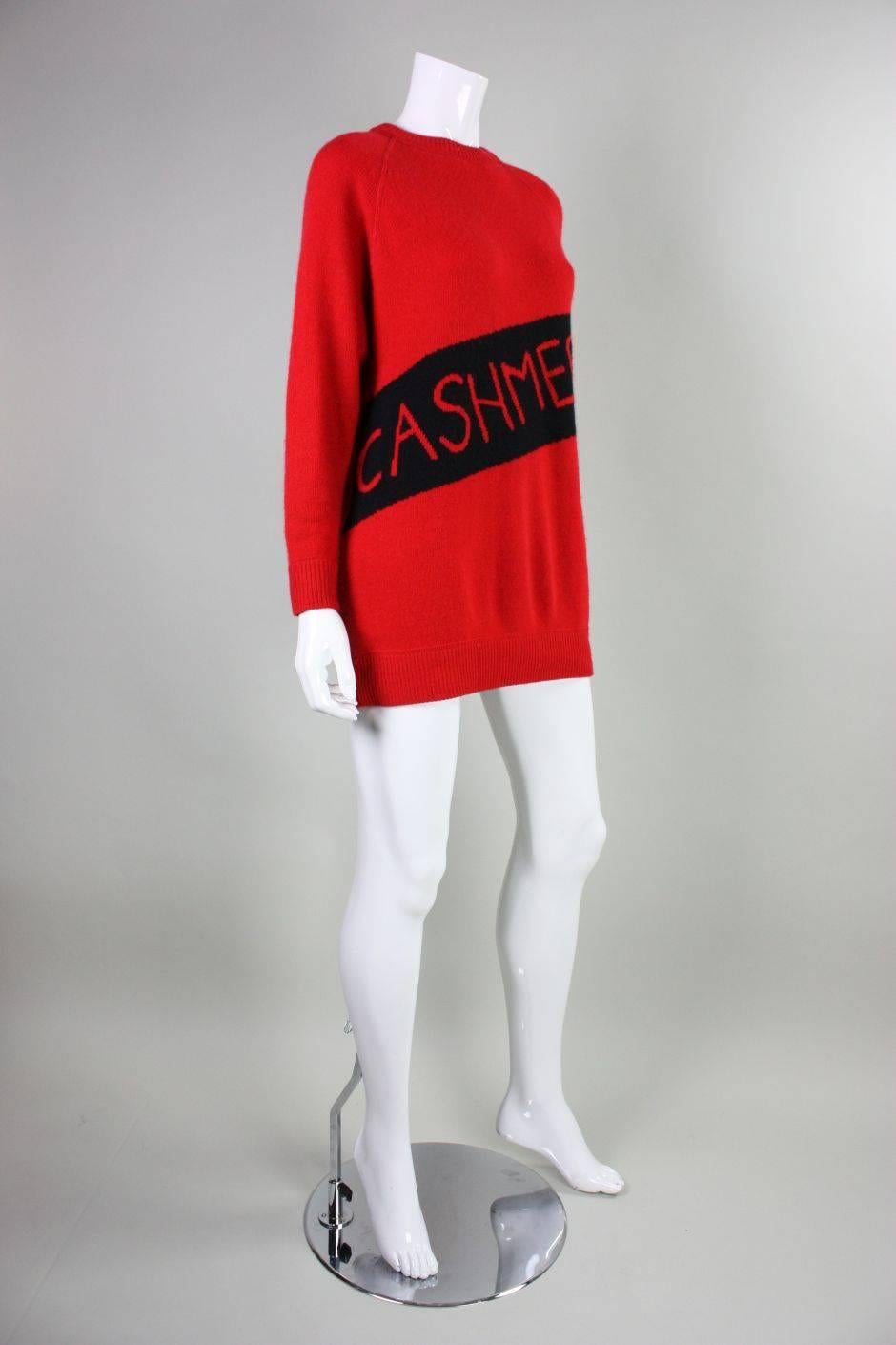Vintage sweater from William Kasper California dates to the 1980's through early 1990's and is made of red cashmere wool.  It humorously has the word "Cashmere" woven diagonally across the front so that everyone knows that you are wearing
