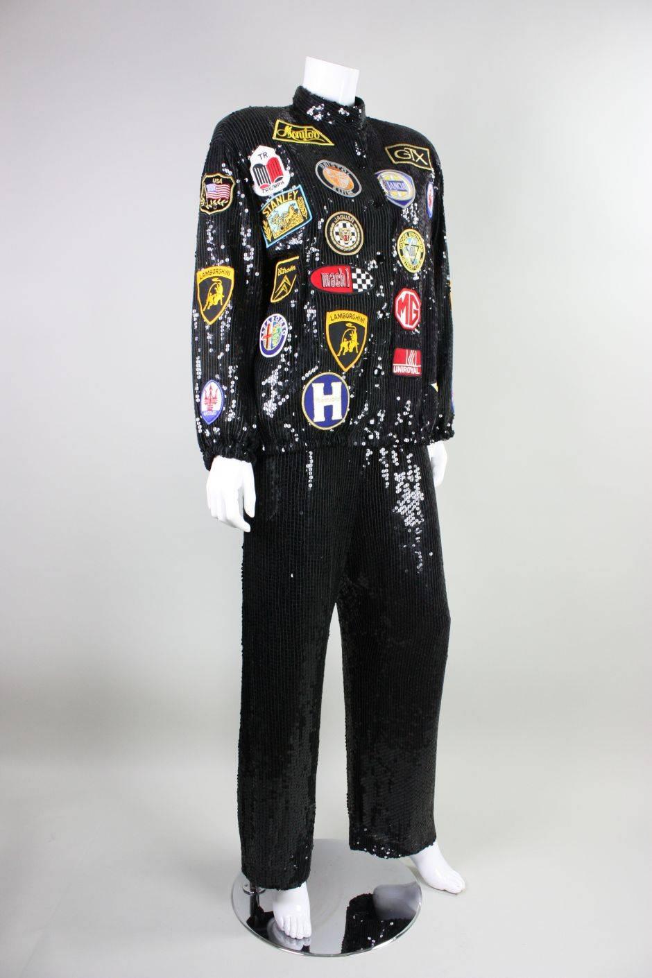 Vintage ensemble from Jeanette for St. Martin is completely covered in black sequins and dates to the 1980's.  Jacket features automotive patches that are artfully arranged on the front, sleeves, and back. It has center front snap closures and