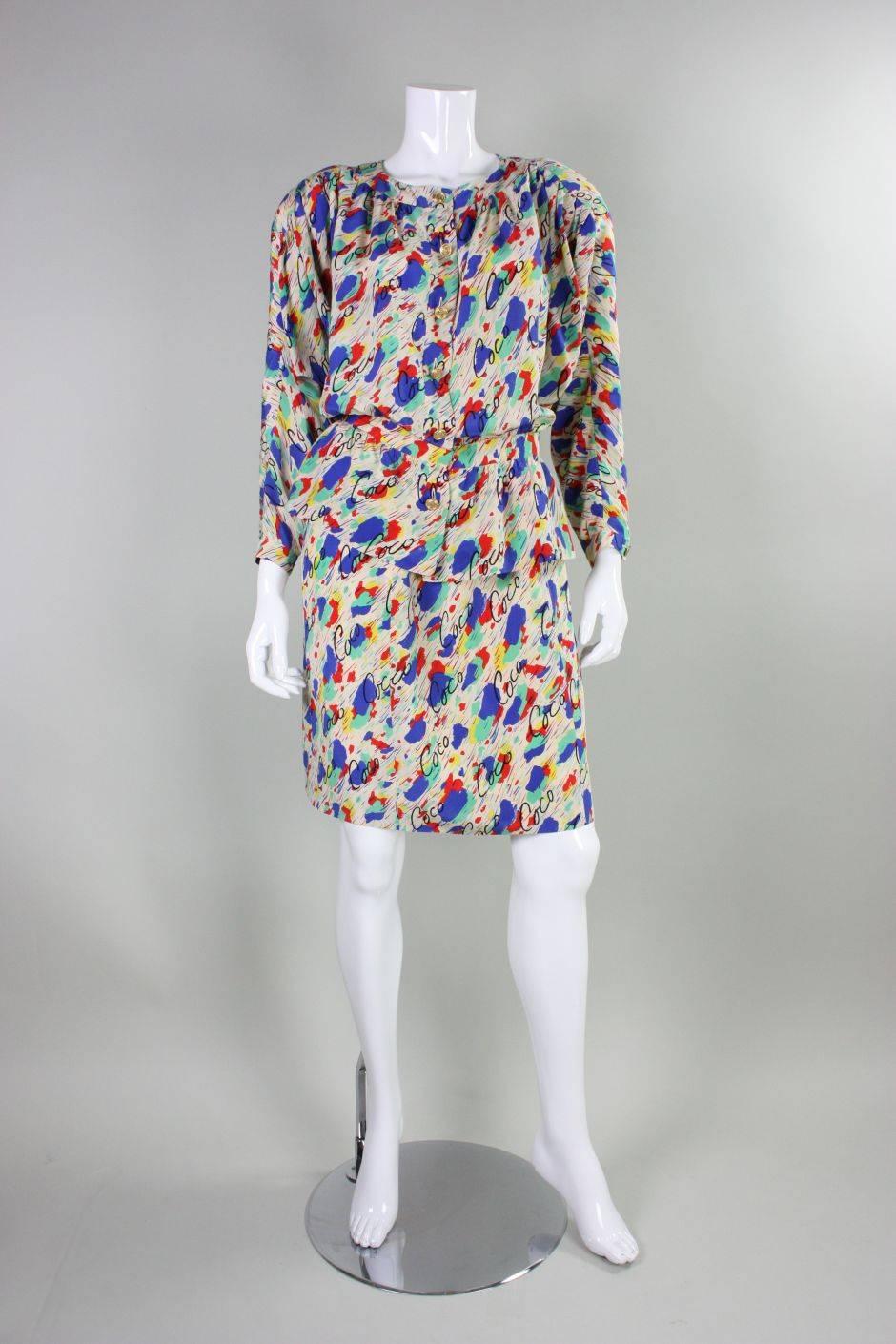 Vintage ensemble from Chanel dates to the 1980's and is made cream silk with a painterly abstract print with 