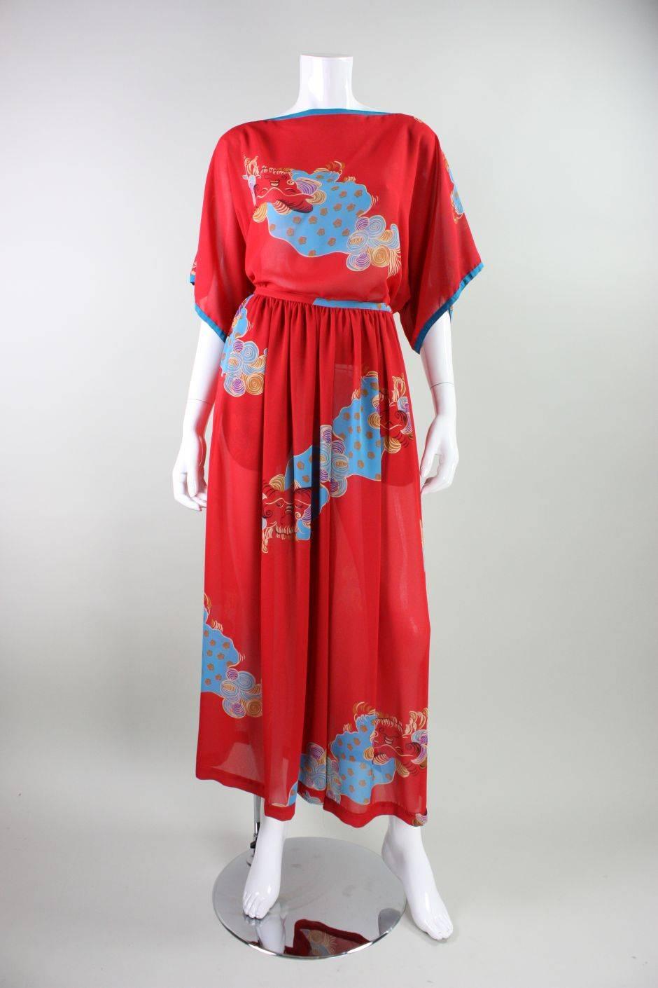 Vintage ensemble from Giorgio Sant Angelo dates to the 1980's and is made of a red synthetic crepe with an Asian-inspired motif.  Oversized blouse has a boat neck, slight batwing shape, and no closures.  Extremely wide-legged trousers have gathering