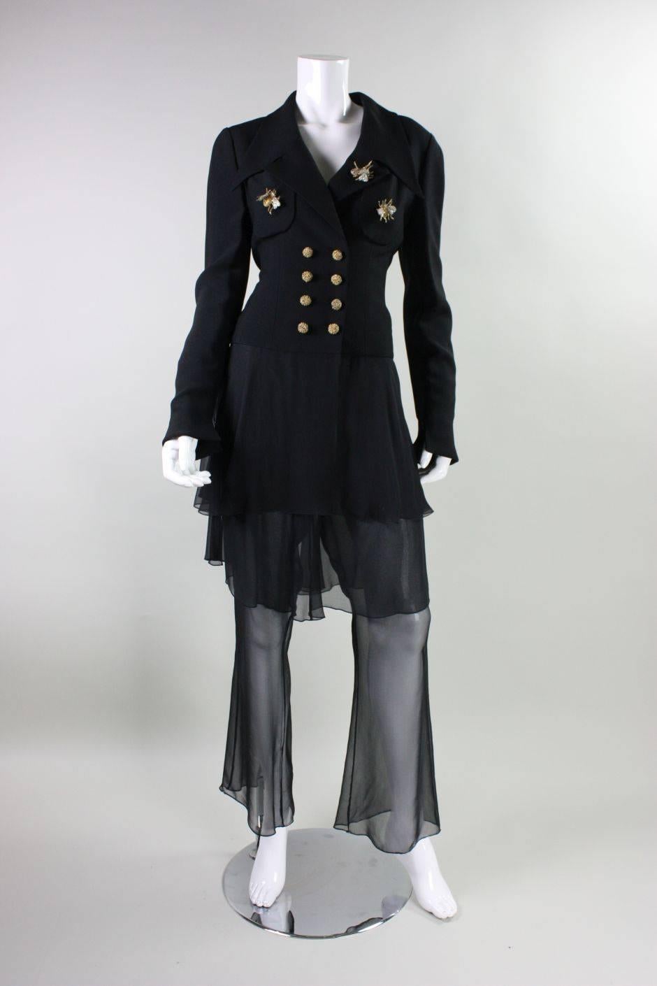 Vintage suit ensemble from Karl Lagerfeld dates to the 1990's and features three-dimensional beaded insect embellishments on the jacket.  Double-breasted jacket has notch label, long sleeves that extend past the wrists, and a chiffon 