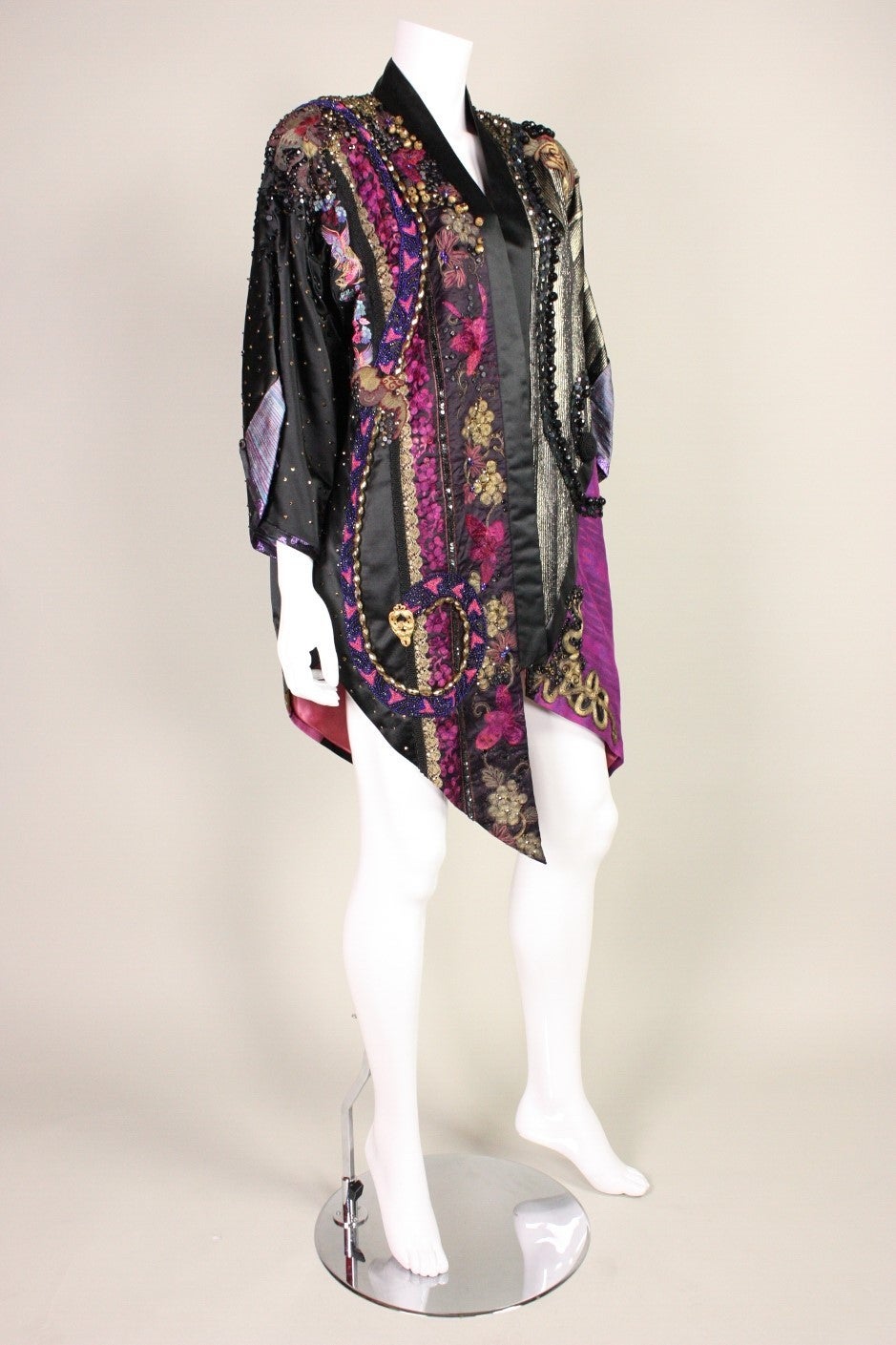 Vintage coat dates to the 1980's and is likely a one of a kind art to wear piece.  It is made of pieced fabric that is adorned with beading, soutache, sequins, and  fragments of antique Chinese textiles.  It has a tag that is hand-signed, 