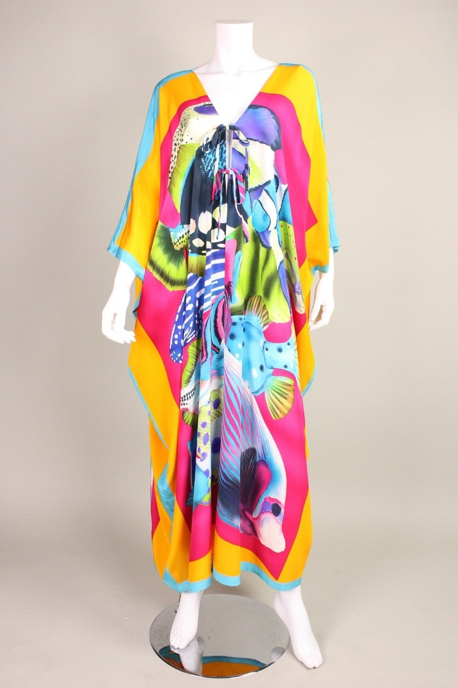 1980's Bill Blass Caftan with Fish Print.  Unlined.  Two center front ties, one at bust and one at waist.  Open other than that down center front.

Labeled size 8, but is more of a one-size fits most.