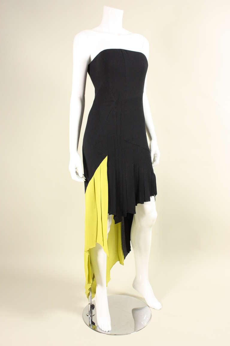 Strapless silk pleated cocktail dress from Versace Couture done in black and chartreuse. Asymmetrical hemline and pleating