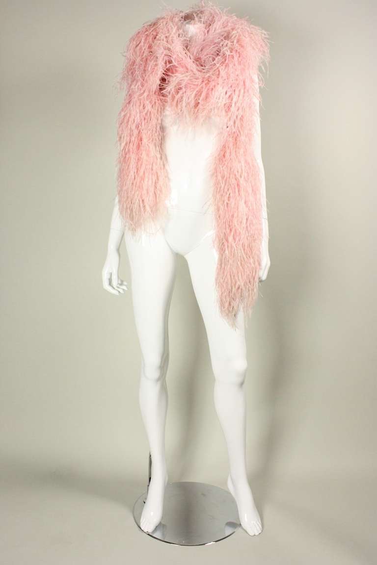 Cotton candy pink boa is comprised of ostrich feathers and sporadic strands of iridescent plastic.  Very glam.  One size.  Length is 120