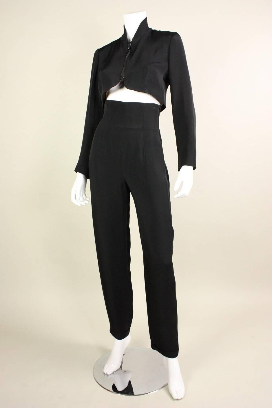 Vintage ensemble from Rifat Ozbek dates to the 1990's and is made of a black acetate and rayon blend fabric.  Cropped jacket has a knit ribbed collar, center front zipper, princess seams, and fabulous gold embroidered wings on the back. 
