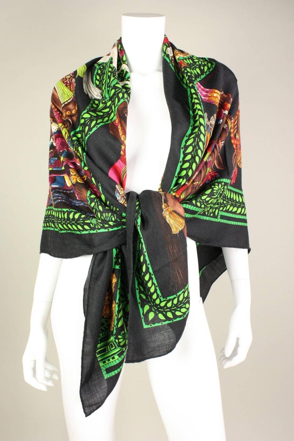 Hermes shawl is made of a silk/cashmere blend and is titled 