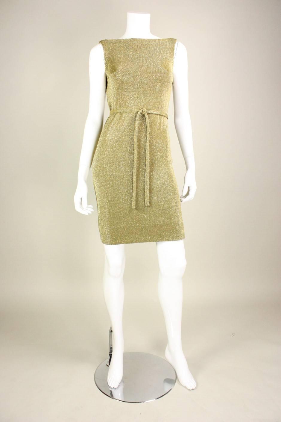 Vintage dress from Rudi Gernreich for Harmon Knitwear is made of gold stretchy metallic knit. Fitted throughout.  Detached belt. Unlined. No closures. 

Labeled vintage size 8.

Measurements-

Bust: 32-34